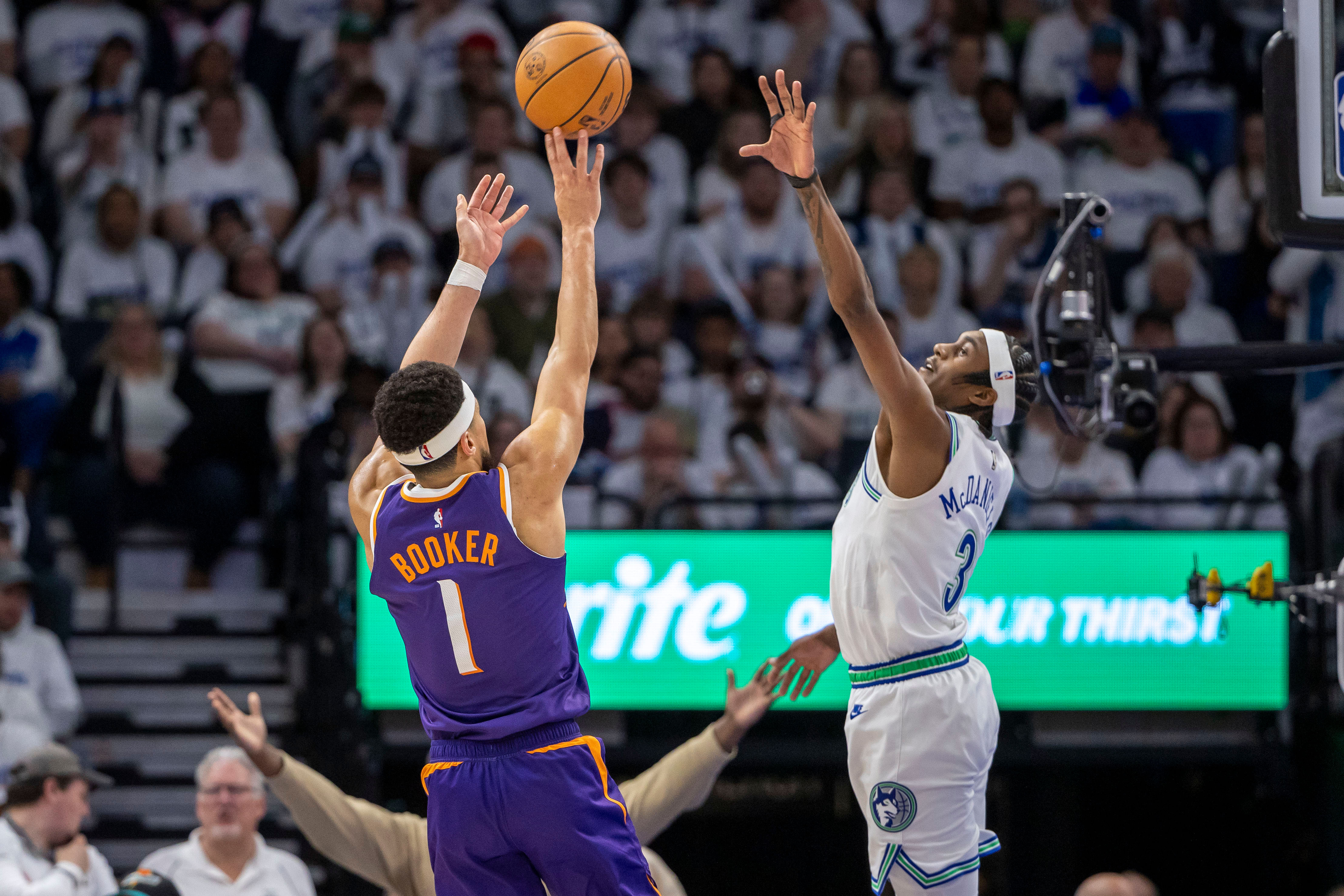 Phoenix Suns superstar shooting guard Devin Booker (left)