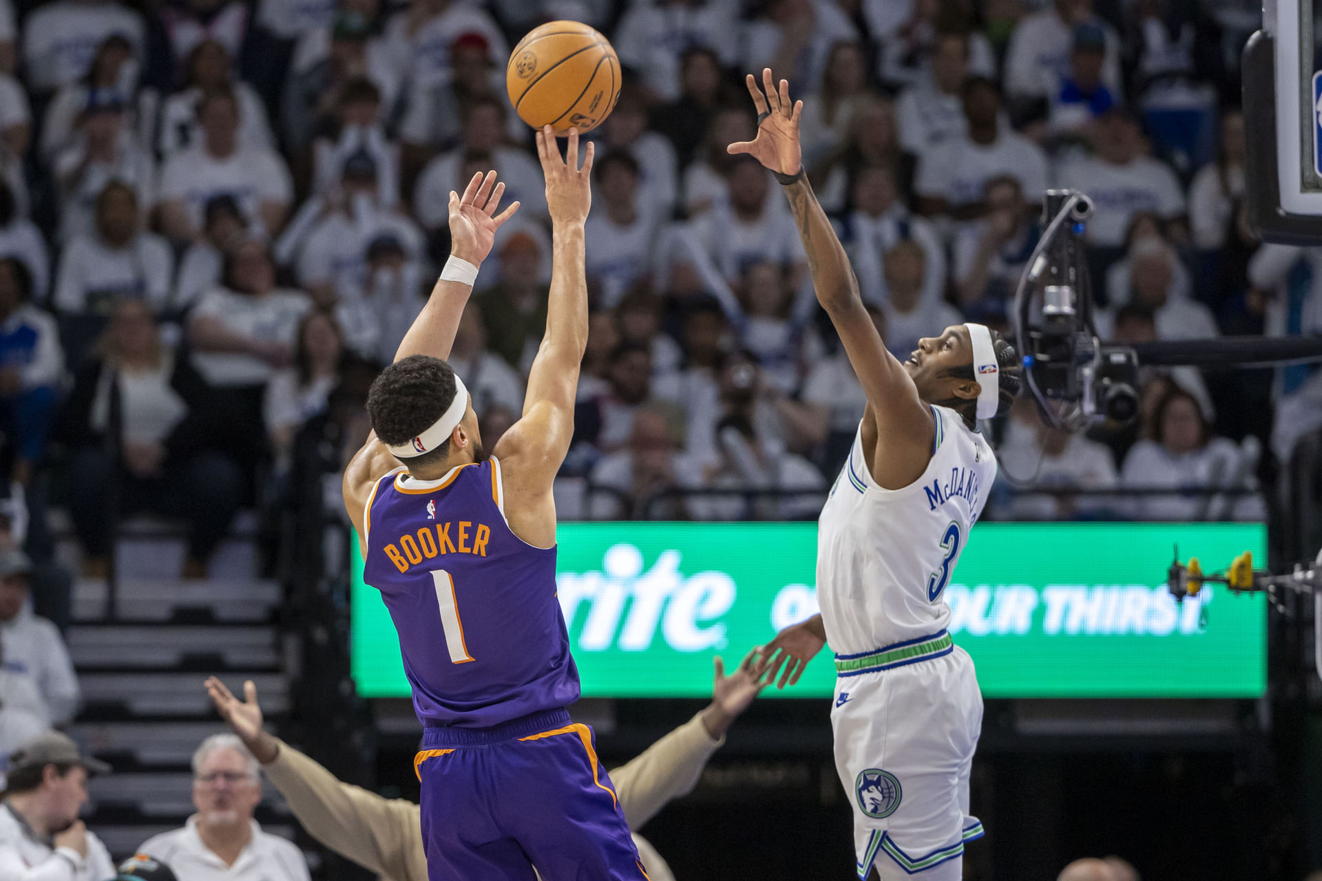 Phoenix Suns superstar shooting guard Devin Booker (left)