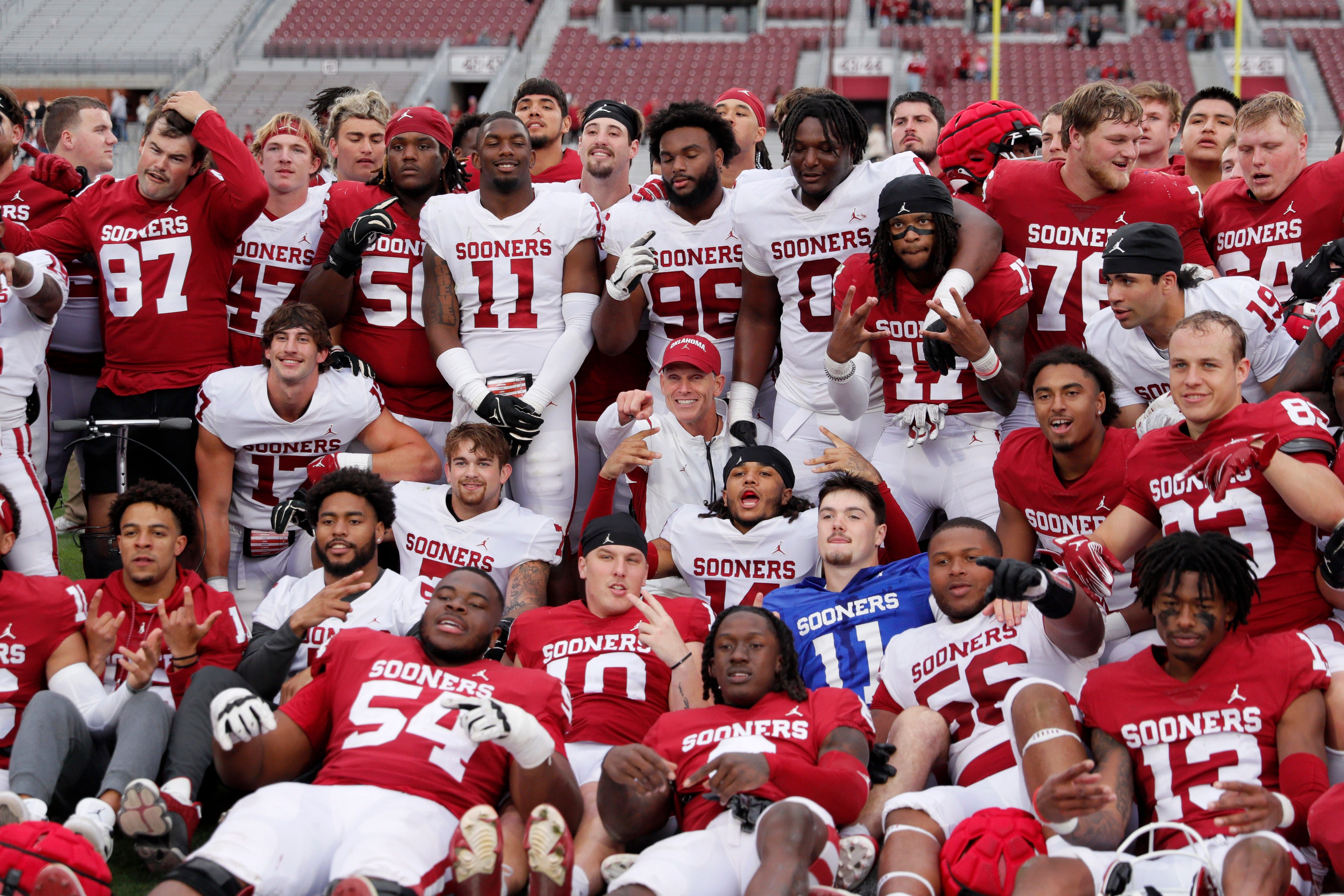 Oklahoma players and coaches pose for a photo after a University of Oklahoma (OU) Sooners spring football game at Gaylord Family-Oklahoma Memorial Stadium.