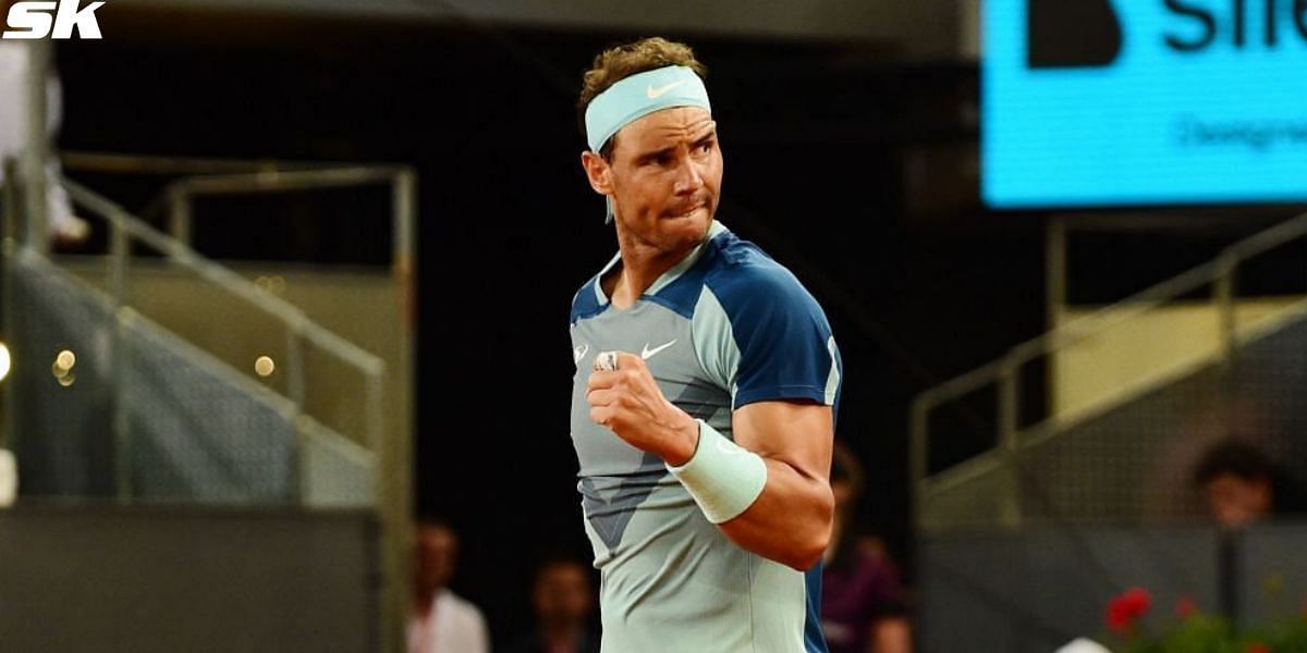 Rafael Nadal fist pumps after winning a point