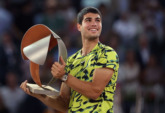 Carlos Alcaraz holding the 2023 Mutua Madrid Open trophy