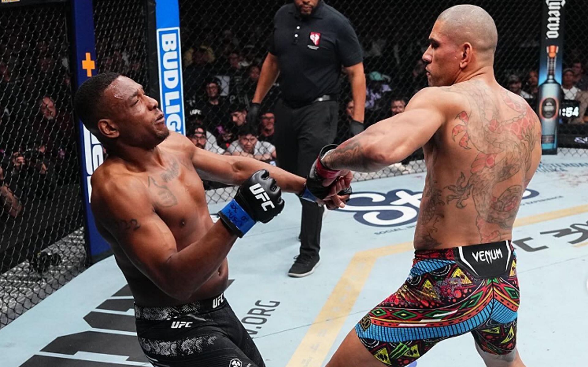 Light heavyweight champion Alex Pereira (right) secured the first defense of his light heavyweight title against Jamahal Hill (left) at UFC 300 [Image Courtesy: @ufc Instagram]]