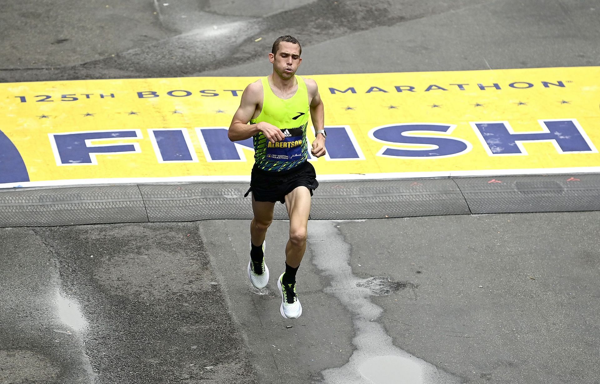 CJ Albertson of the United States crosses the finish line during the 125th Boston Marathon in 2021 in Boston, Massachusetts.