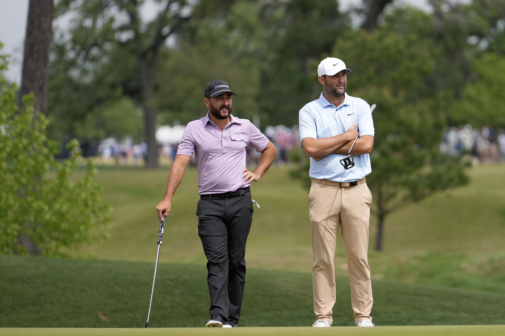 Stephan Jaeger of Germany and Scottie Scheffler of the United States wait to putt on the second green during the final round of the Texas Children&#039;s Houston Open (Photo by Raj Mehta/Getty Images)