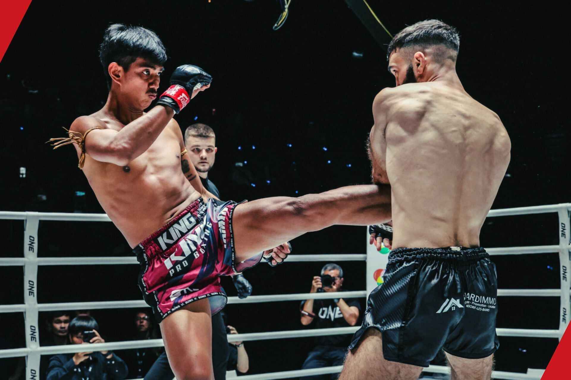 Yamin PK Saenchai (left) in action against Joachim Ouraghi (right).