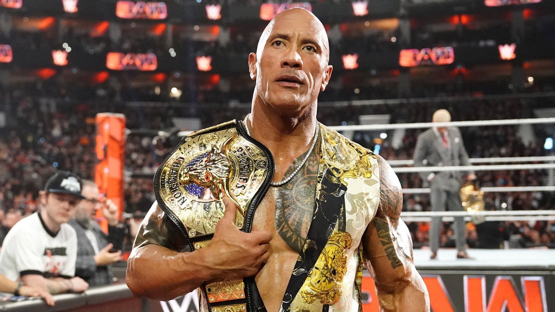 The Rock exits WWE RAW with Cody Rhodes in the background