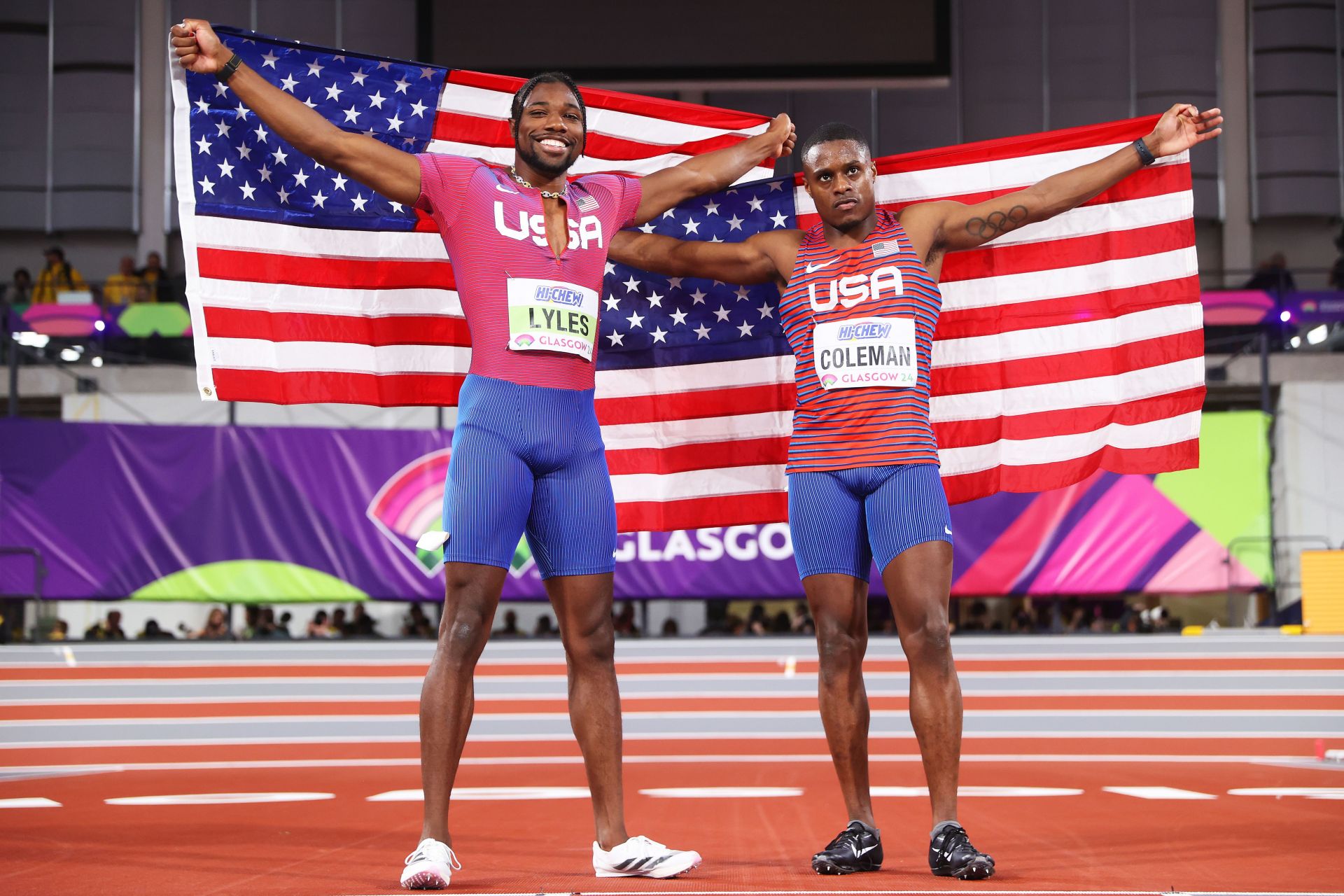 Noah Lyles and Christian Coleman pose for a photo after competing in the Men\s 60m Final at the 2024 World Athletics Indoor Championships in Glasgow, Scotland.