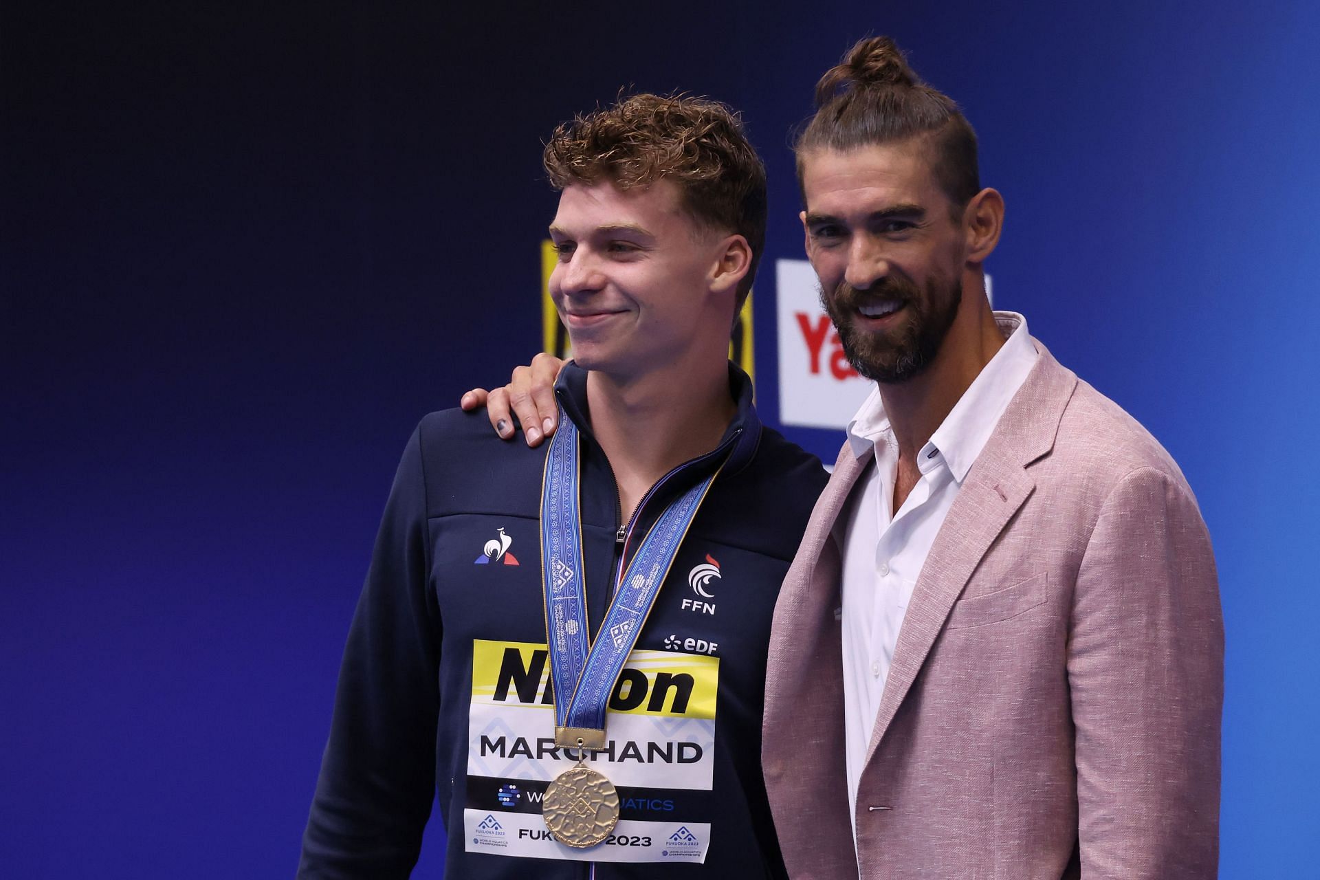 Leon Marchand and Michael Phelps during the Fukuoka 2023 World Aquatics Championships: Swimming - Day 1