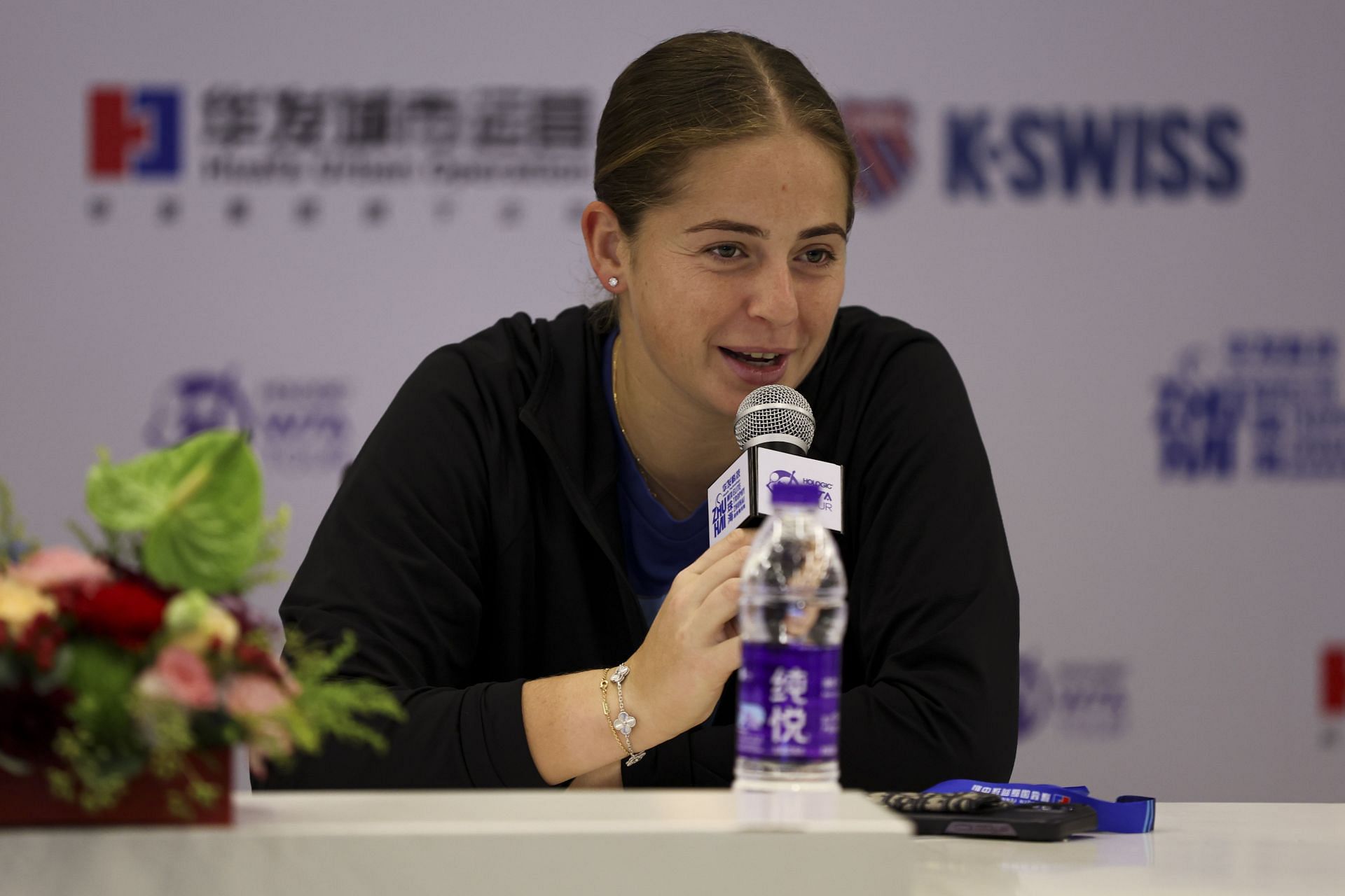 Jelena Ostapenko addresses the media during a press conference.