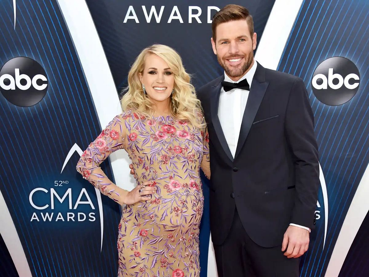 Carrie Underwood and Mike Fisher at the CMA Awards (Image via Getty)
