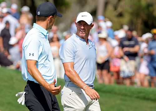 Rory McIlroy and Jordan Spieth on the greens