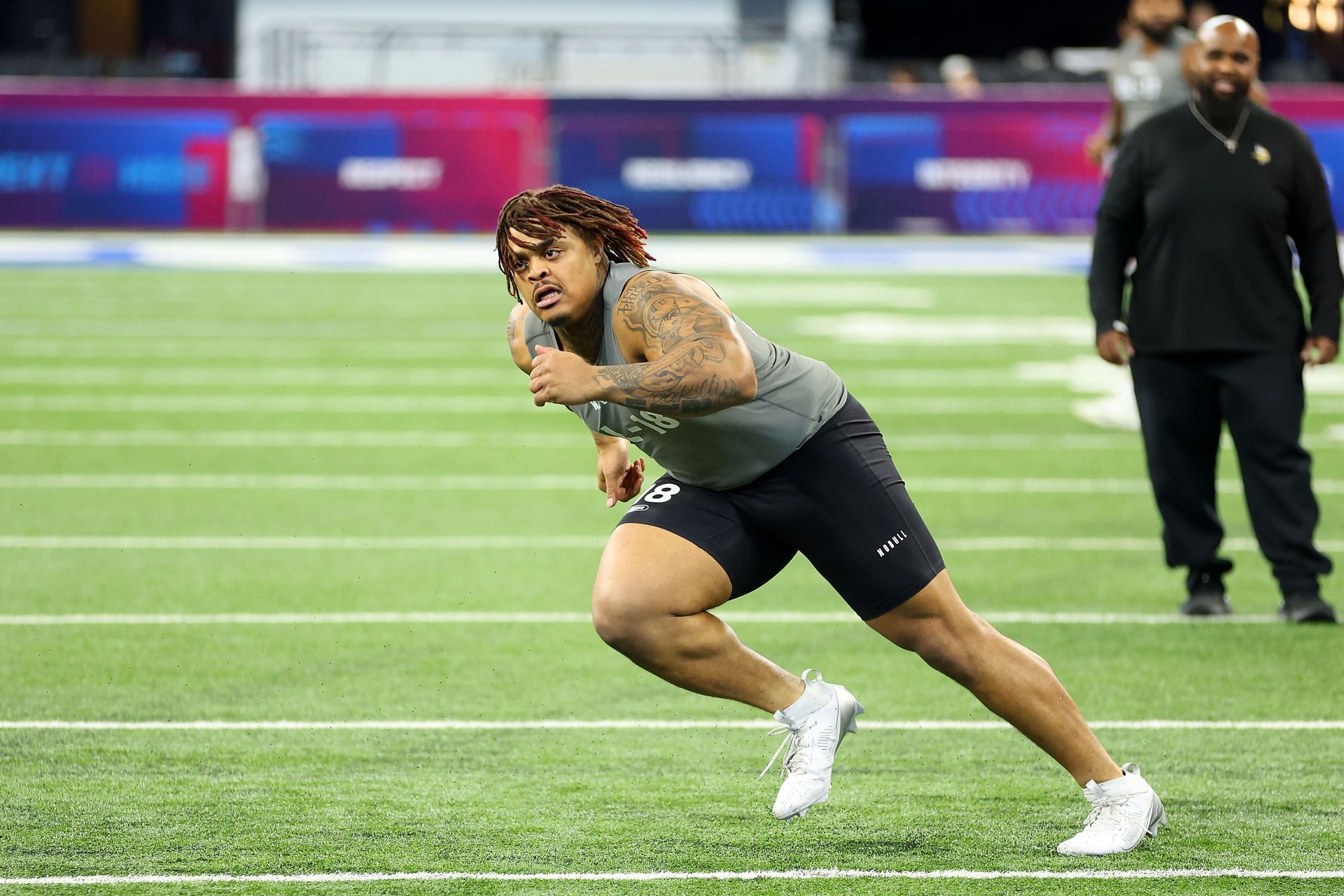 Byron Murphy #DL18 of Texas participates in a drill during the NFL Combine