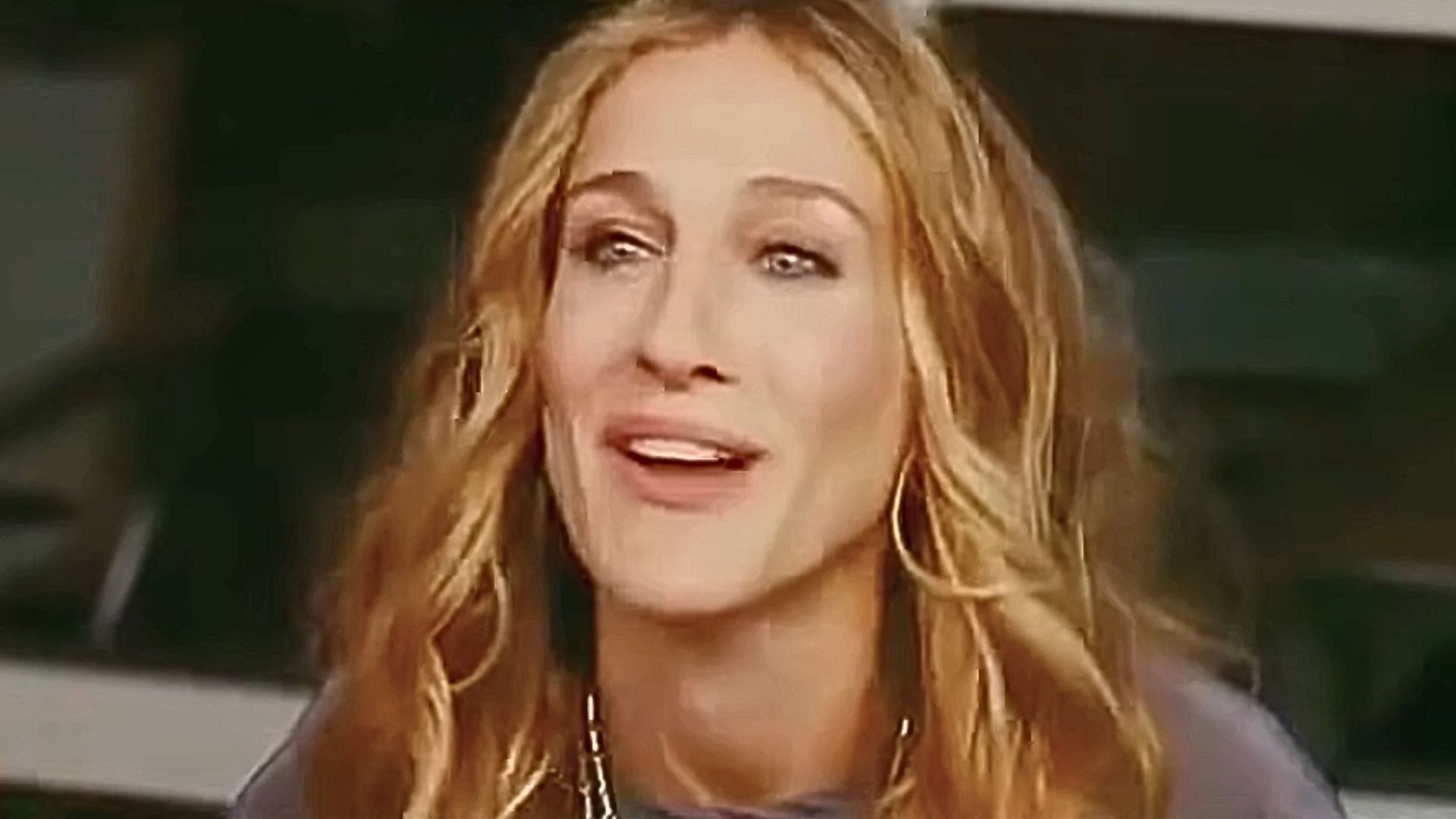 Carrie Bradshaw, played by Sarah Jessica Parker (Image via YouTube/Rotten Tomatoes Classic Trailers)