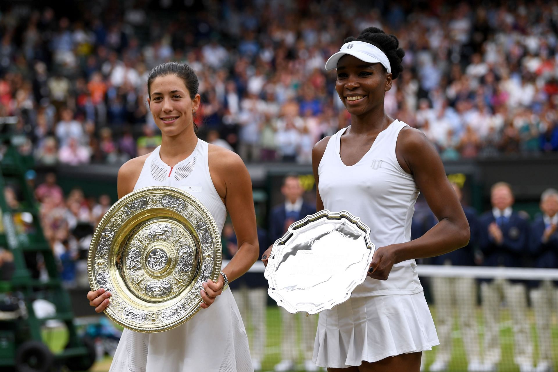 Garbine Muguruza (L) and Venus Williams (R) during the trophy presentation ceremony at the 2017 Wimbledon Championships