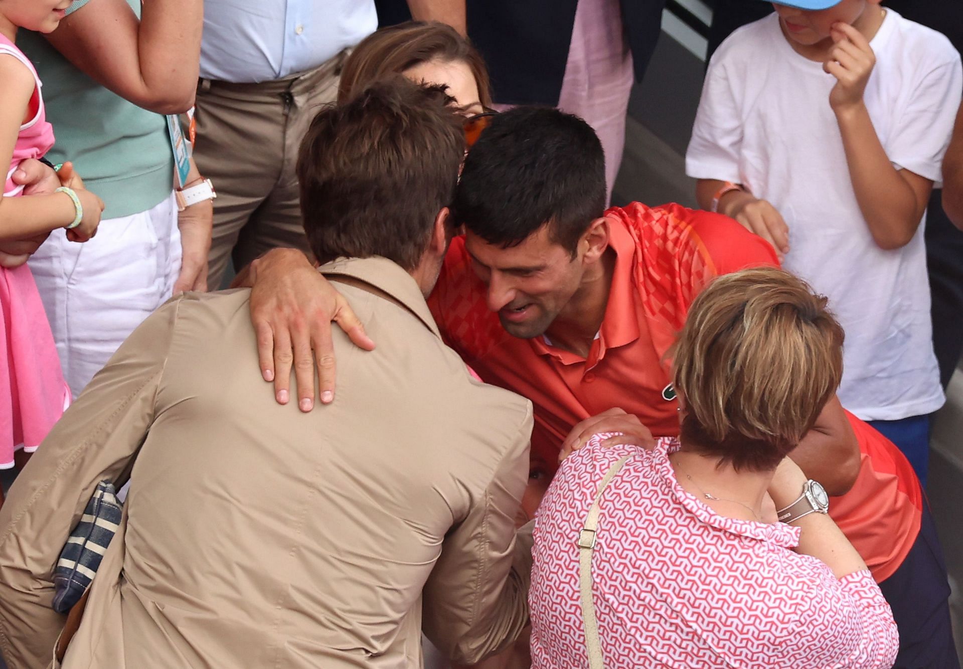 Novak Djokovic hugs Tom Brady after 2023 French Open triumph