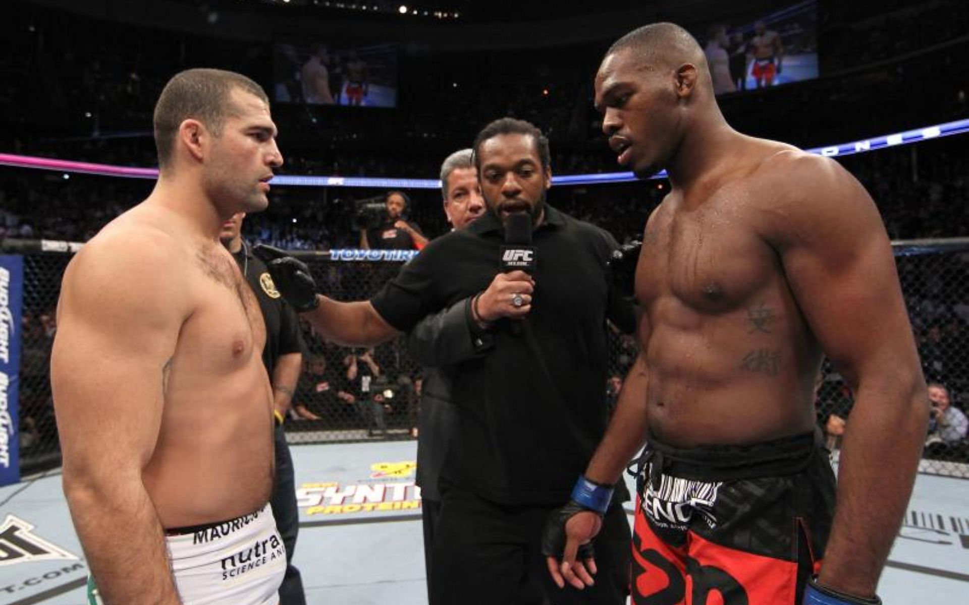 Jon Jones (right) in his first title fight against Mauricio Rua (left) at UFC 128 [Photo Courtesy of Getty Images]