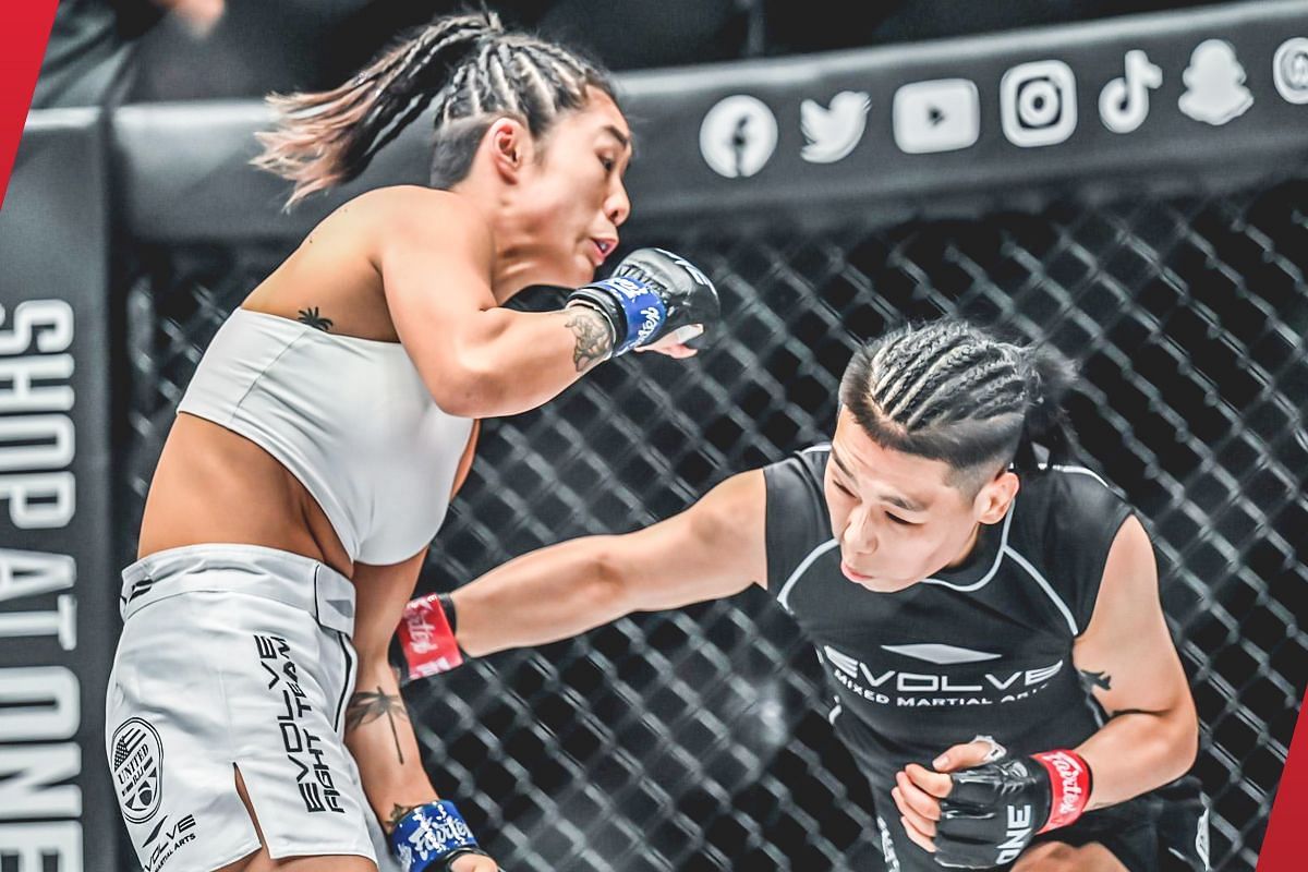 Xiong Jing Nan (right) fires a body blow against Angela Lee (left) [Photo via: ONE Championship]