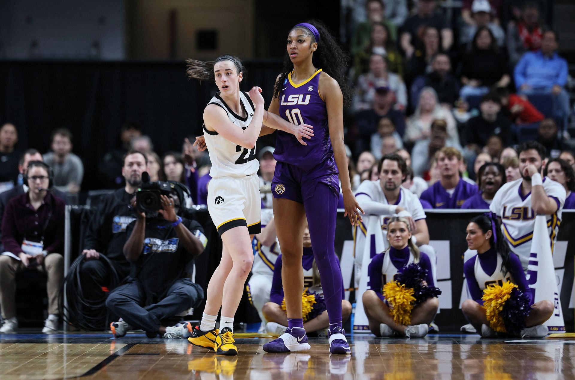 Angel Reese (right) guards Iowa&#039;s Caitlin Clark in LSU-Iowa&#039;s Elite Eight encounter this year.