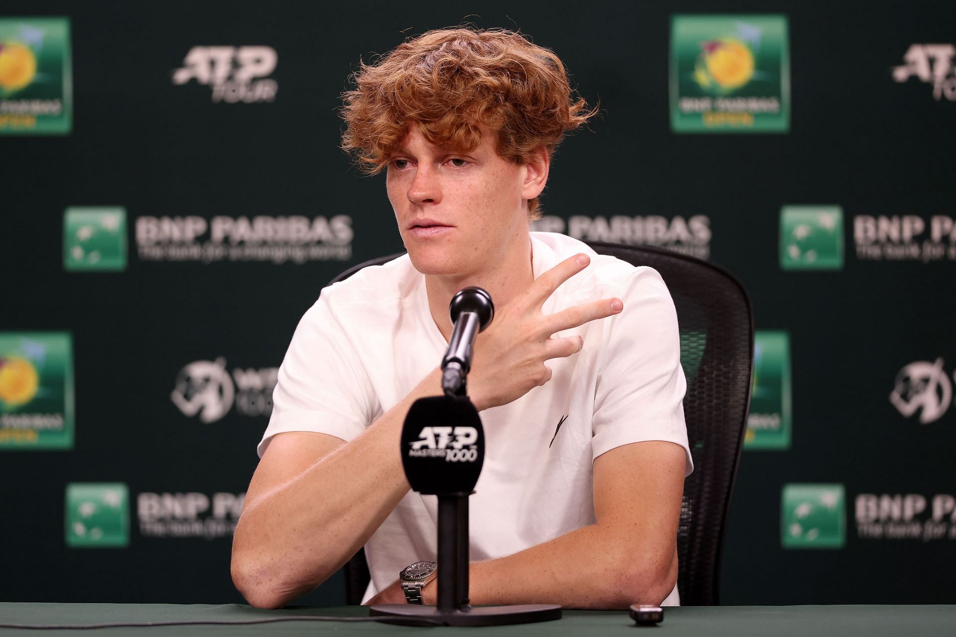 Jannik Sinner talking at a press conference