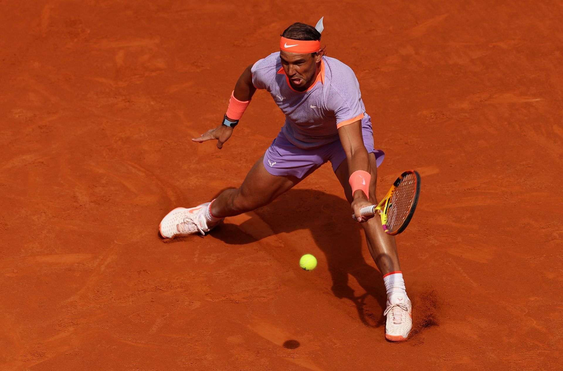 Rafael Nadal retrieves a ball at the 2024 Madrid Open