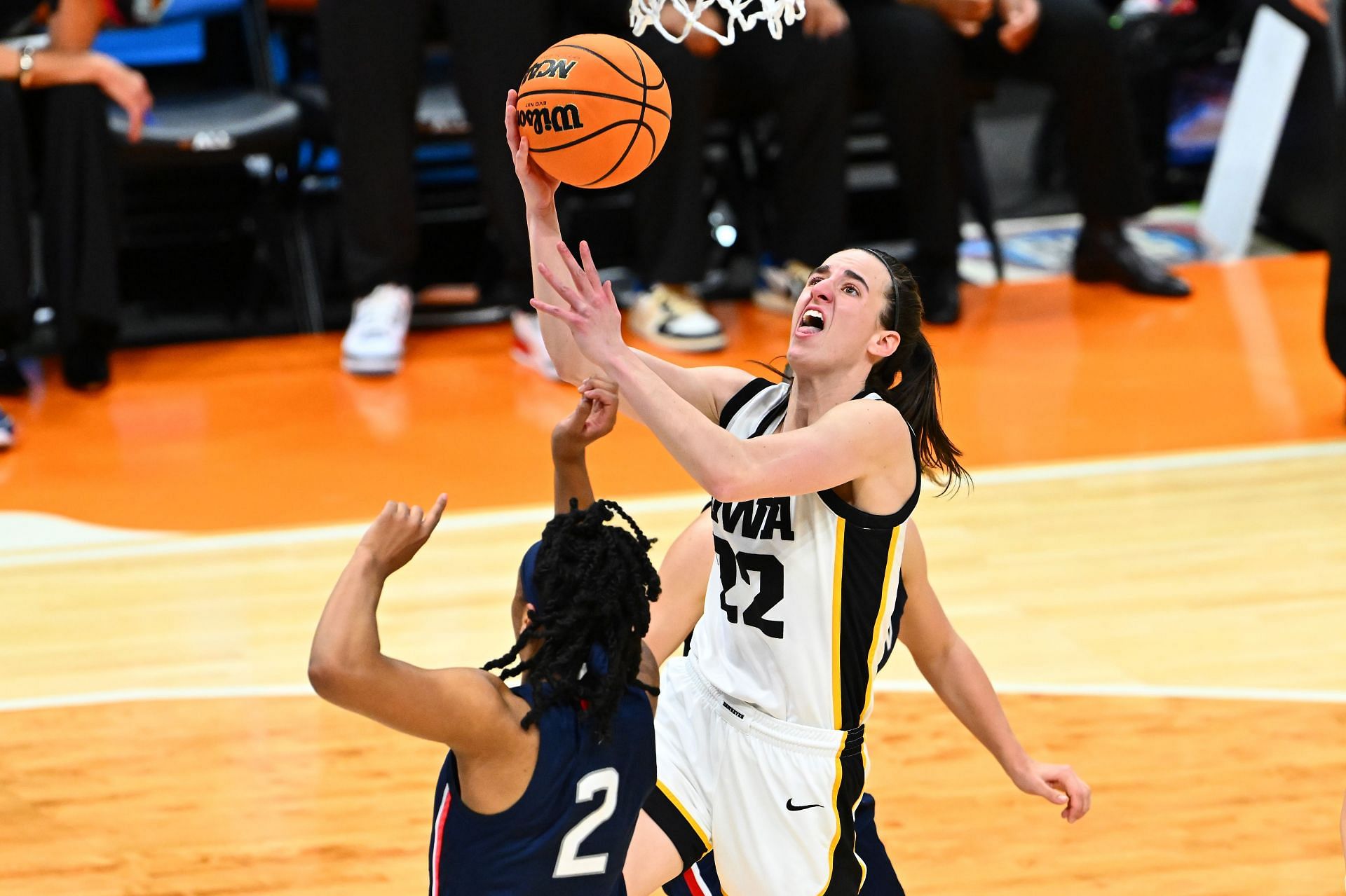 Iowa&#039;s Caitlin Clark attempts a layup over UConn&#039;s KK Arnold in the Final Four.