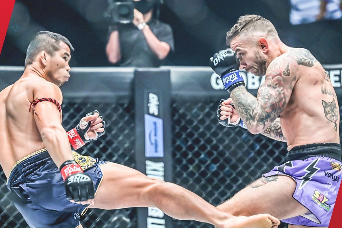 Nong-O (left) fires a brutal leg kick against Liam Harrison (right) [Photo via: ONE Championship]