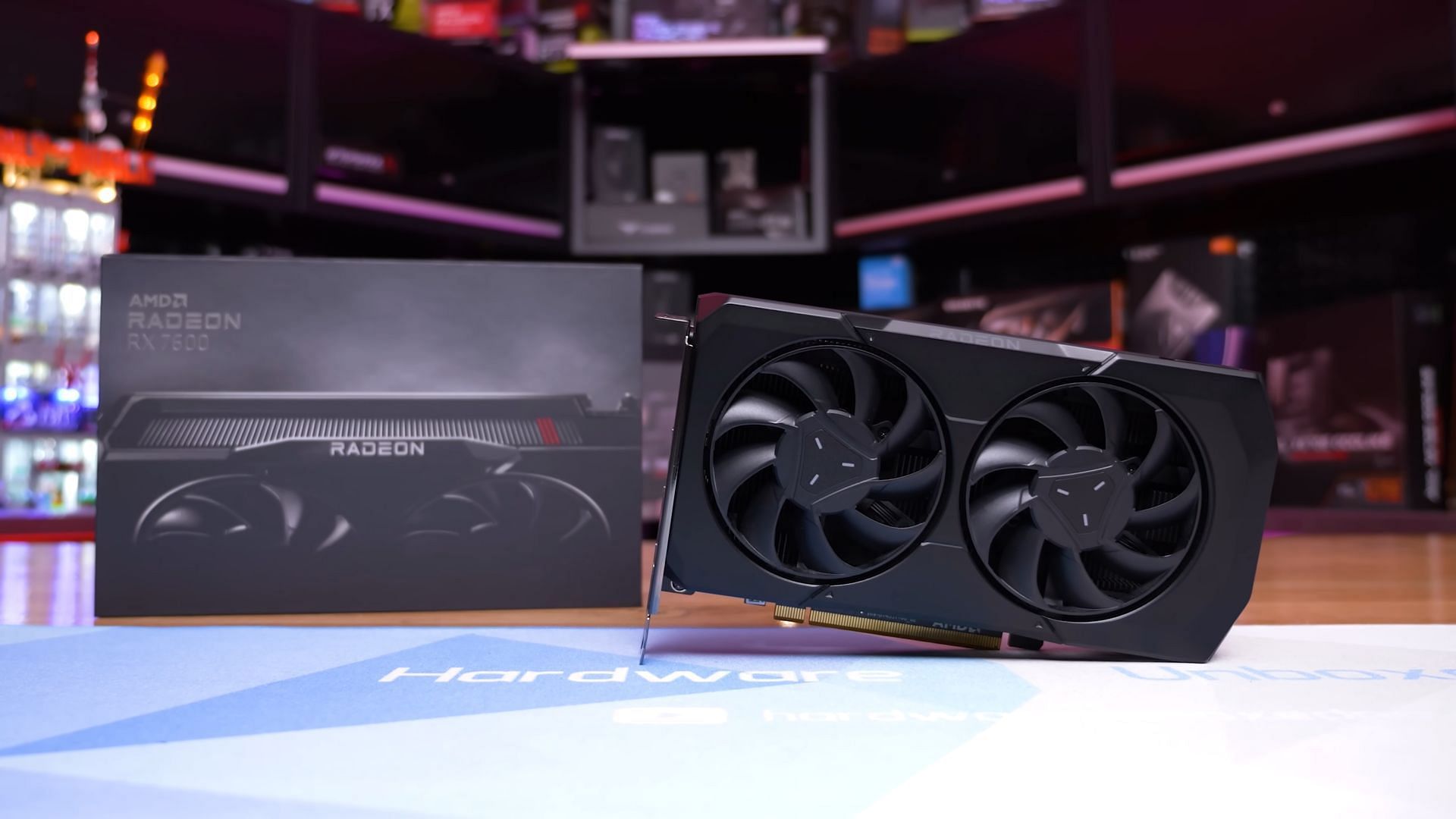 The Radeon 7600 with its box (Image via Hardware Unboxed/YouTube)
