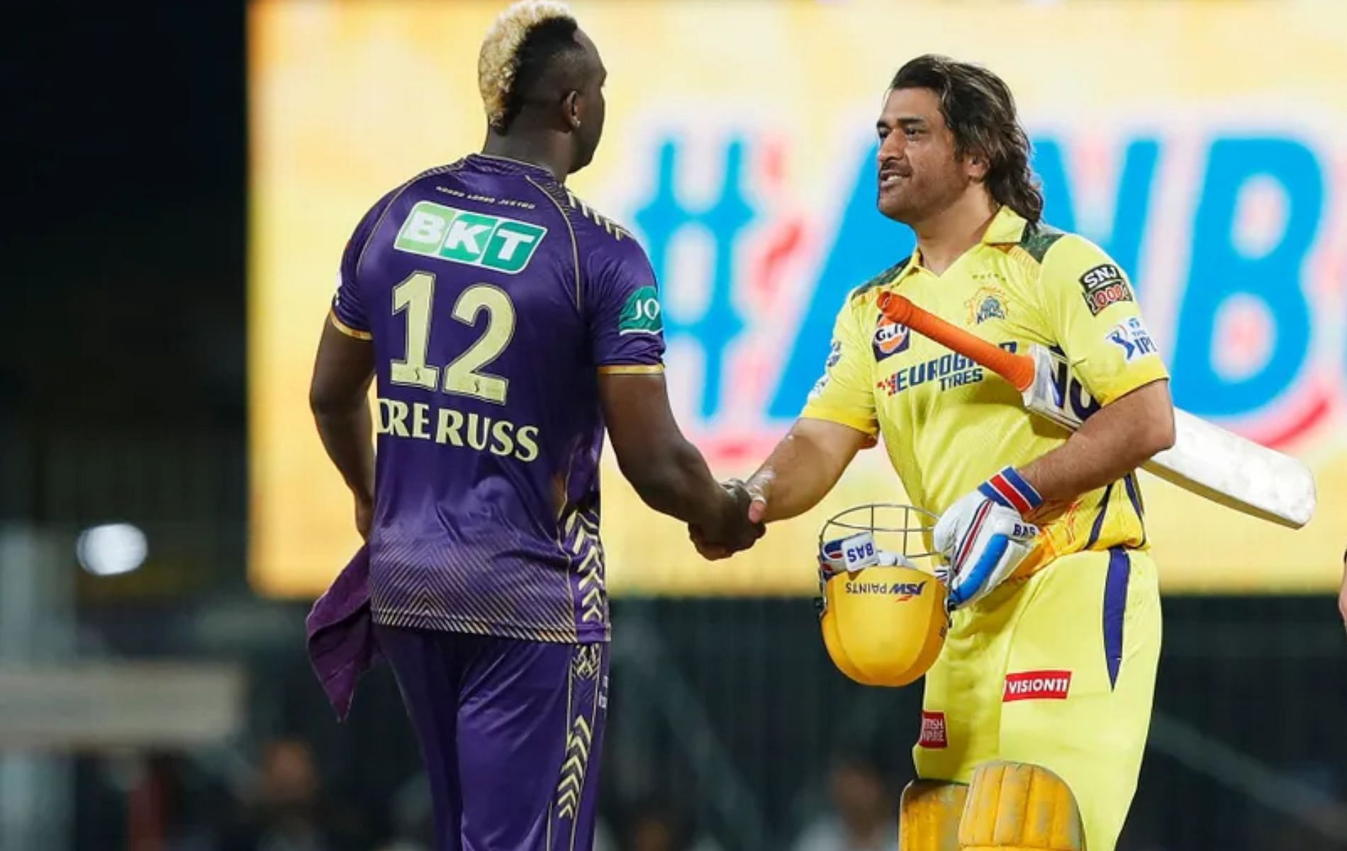 Andre Russell (L) with MS Dhoni (R).