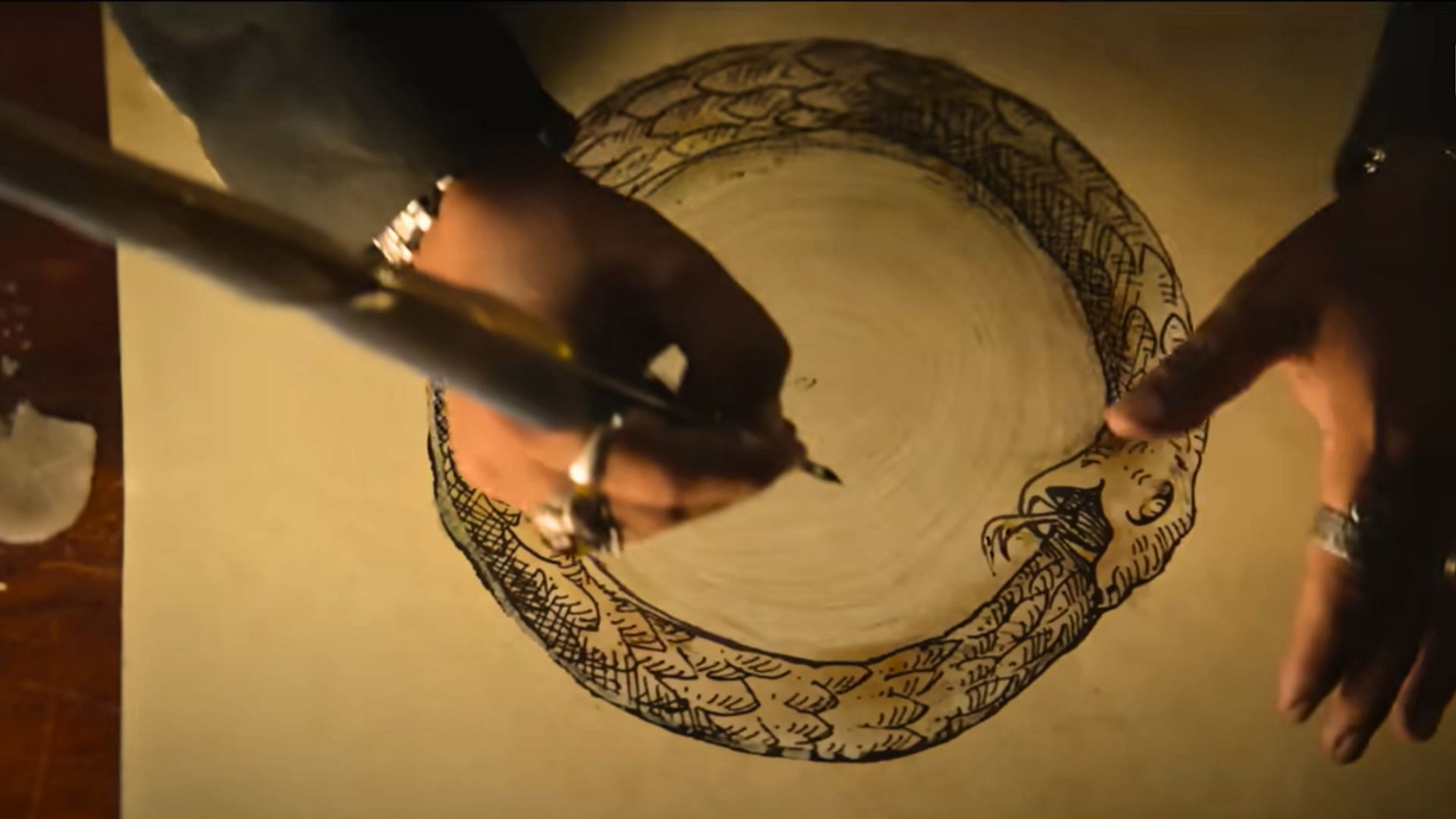 The ouroboros seen in the teaser may have many interpretations (Image via Netflix)