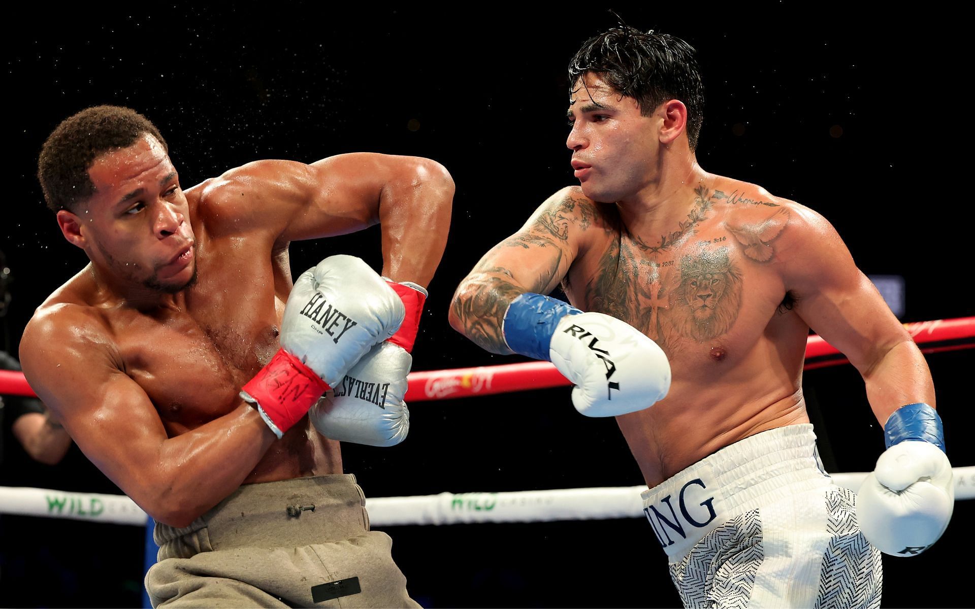 Devin Haney (left) suffered his first professional boxing defeat, a majority decision loss against Ryan Garcia (right) [Image courtesy: Getty Images]