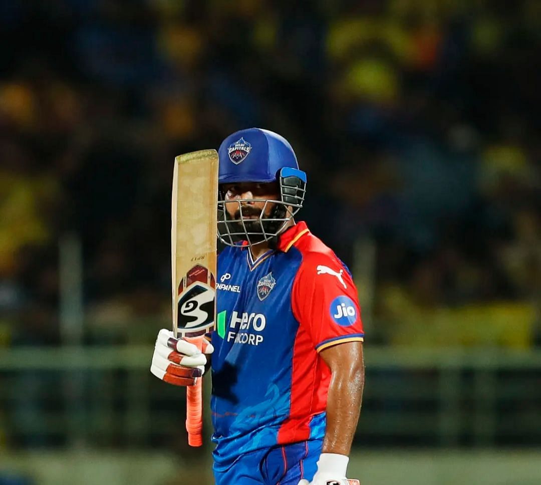 Rishabh Pant raising his bat after a fifty