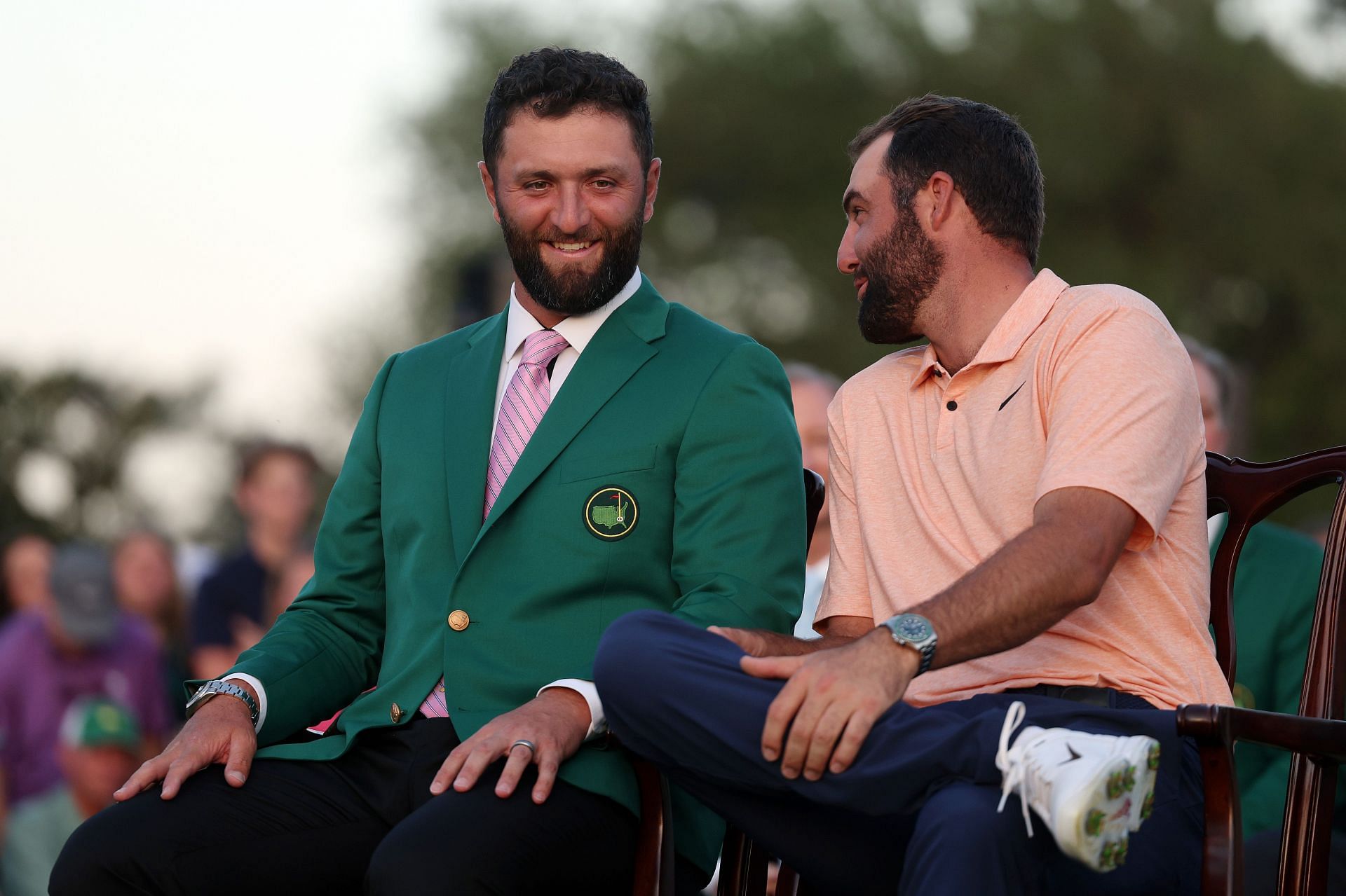 Jon Rahm of Spain (L) and Scottie Scheffler of the United States attend the Green Jacket Ceremony after Scheffler won the 2024 Masters Tournament (Photo by Warren Little/Getty Images)