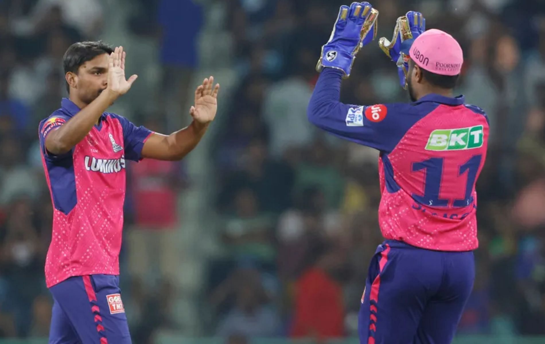 Sandeep Sharma (L) celebrates a wicket with Sanju Samson (R).