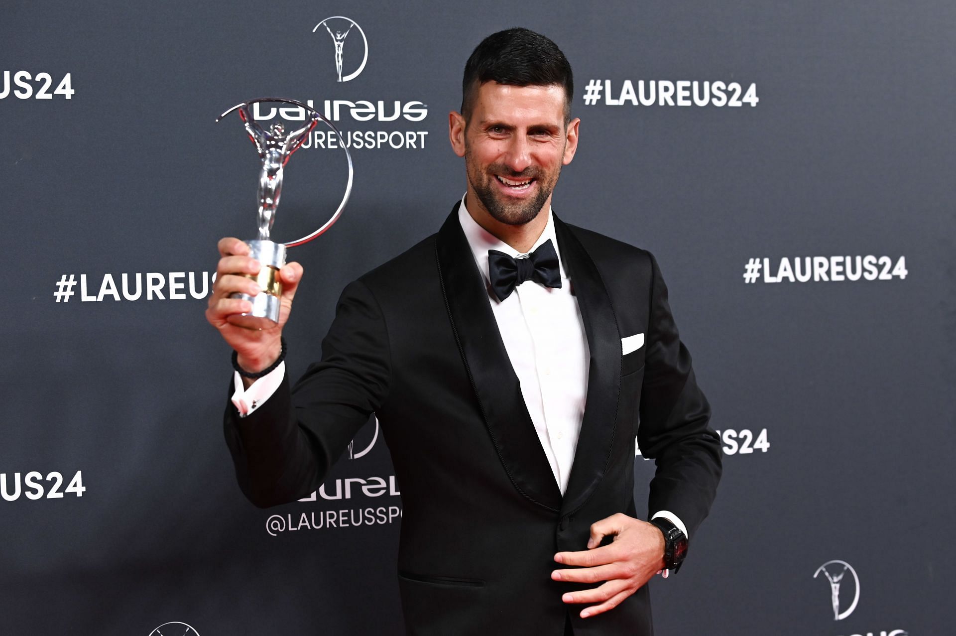 Novak Djokovic poses with his Laureus Sportsman of the Year Award