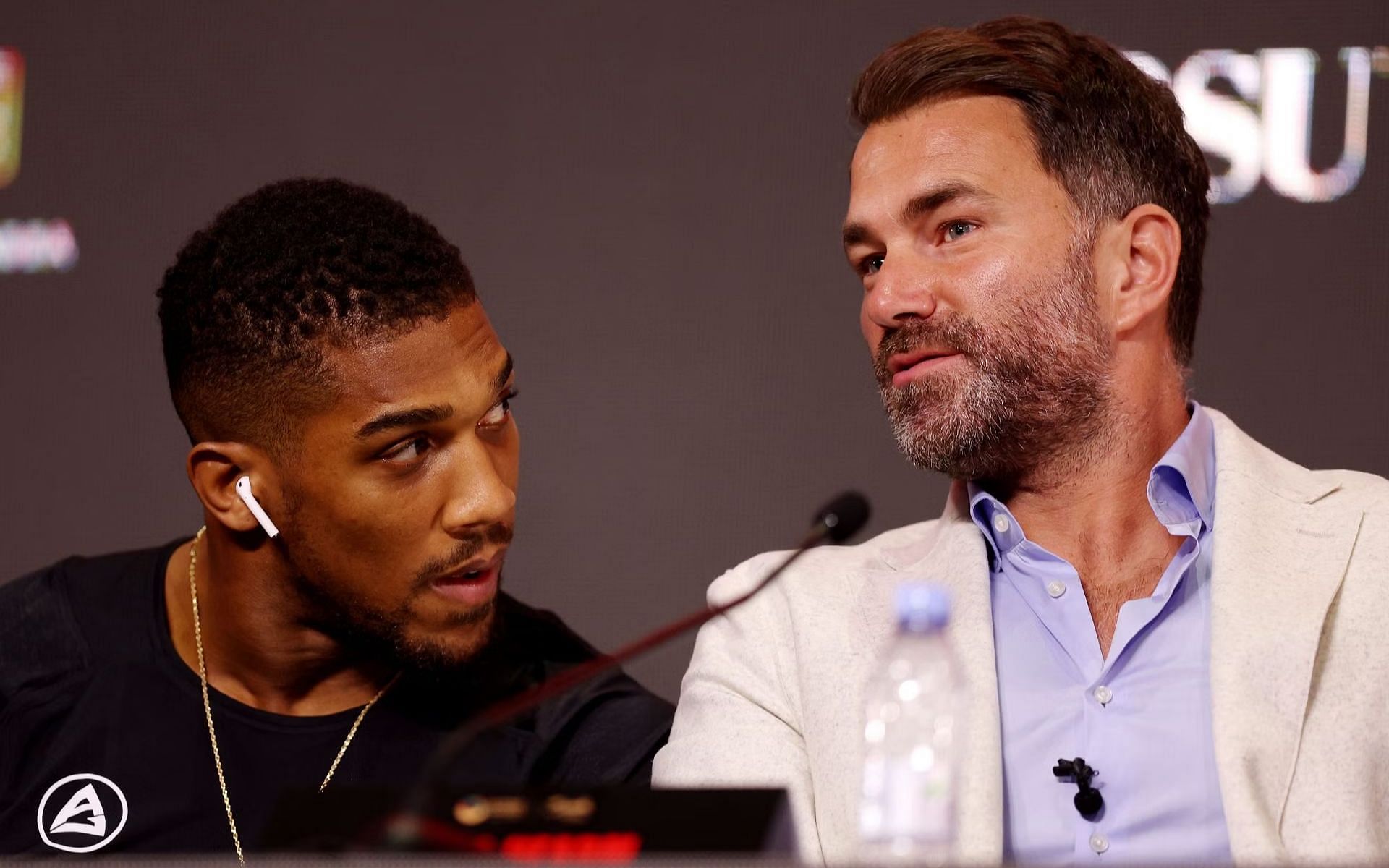 Eddie Hearn (right) shares thoughts on Anthony Joshua (left) wanting to retire in 2026 [Image Courtesy: @GettyImages]