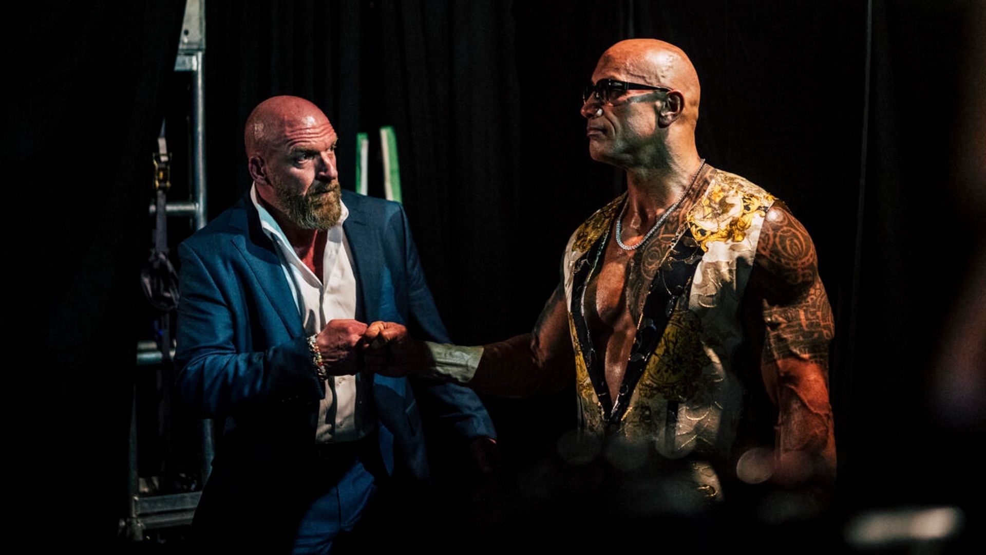 The Rock backstage with WWE CCO Triple H