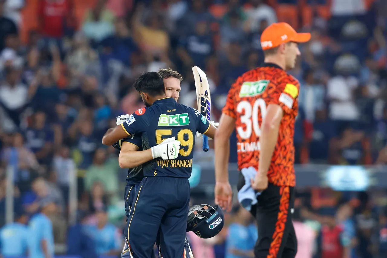 SRH captain Pat Cummins (foreground) looks on in a forlorn manner after his team were beaten by GT on Sunday. [IPL]