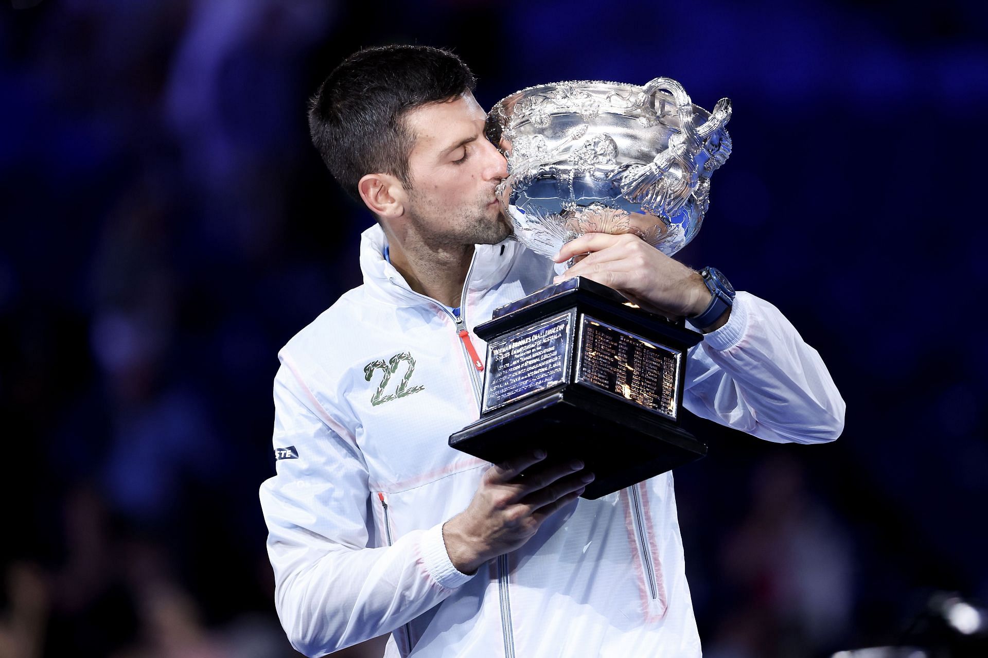 Novak Djokovic kissing the 2023 Australian Open trophy