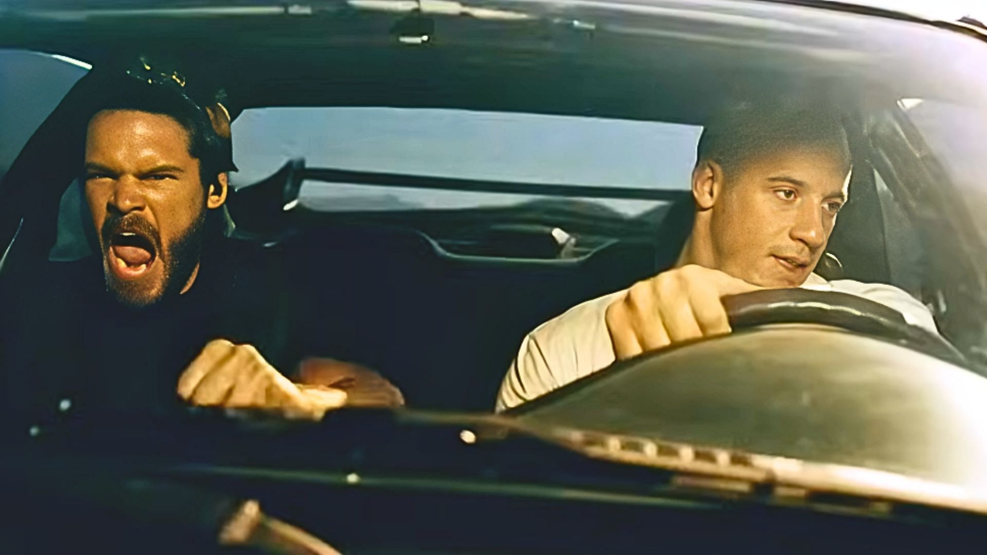 Paul Walker (L) and Vin Diesel (R) in The Fast And The Furious (Image via YouTube/The Fast Saga, 1:12)