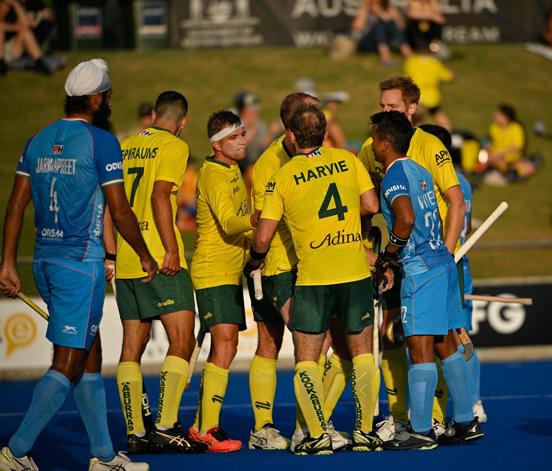 Australian players celebrate a goal in the series against India