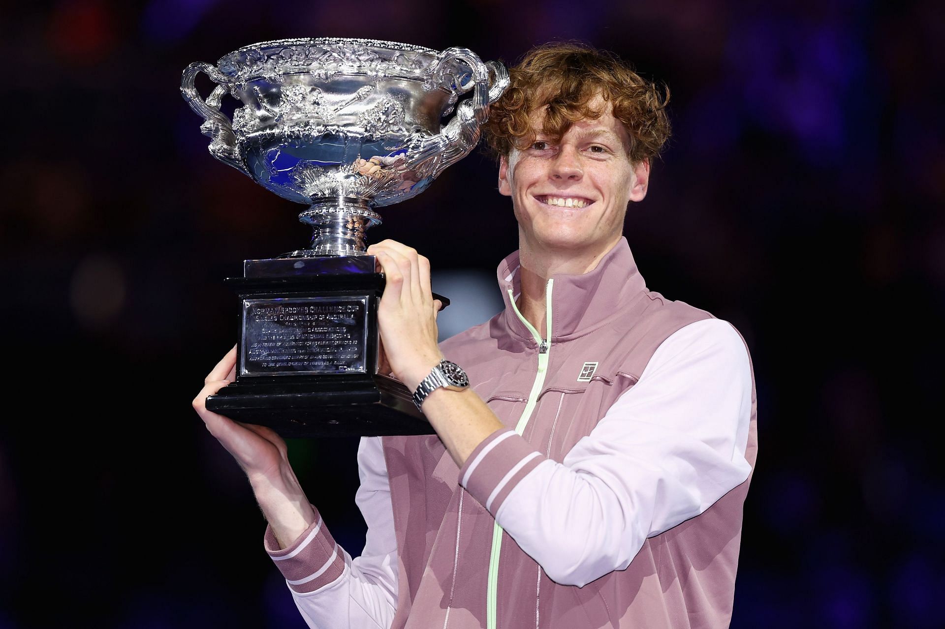 Jannik Sinner posing with the 2024 Australian Open trophy