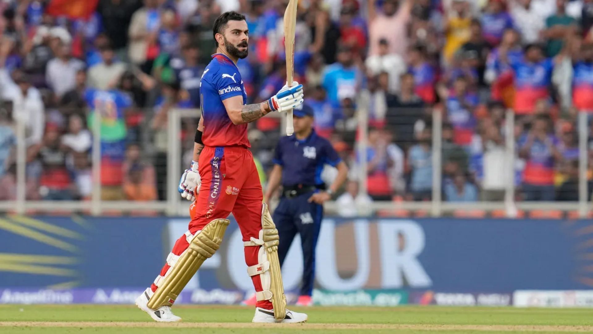 Virat Kohli celebrates after reaching his 54th IPL fifty