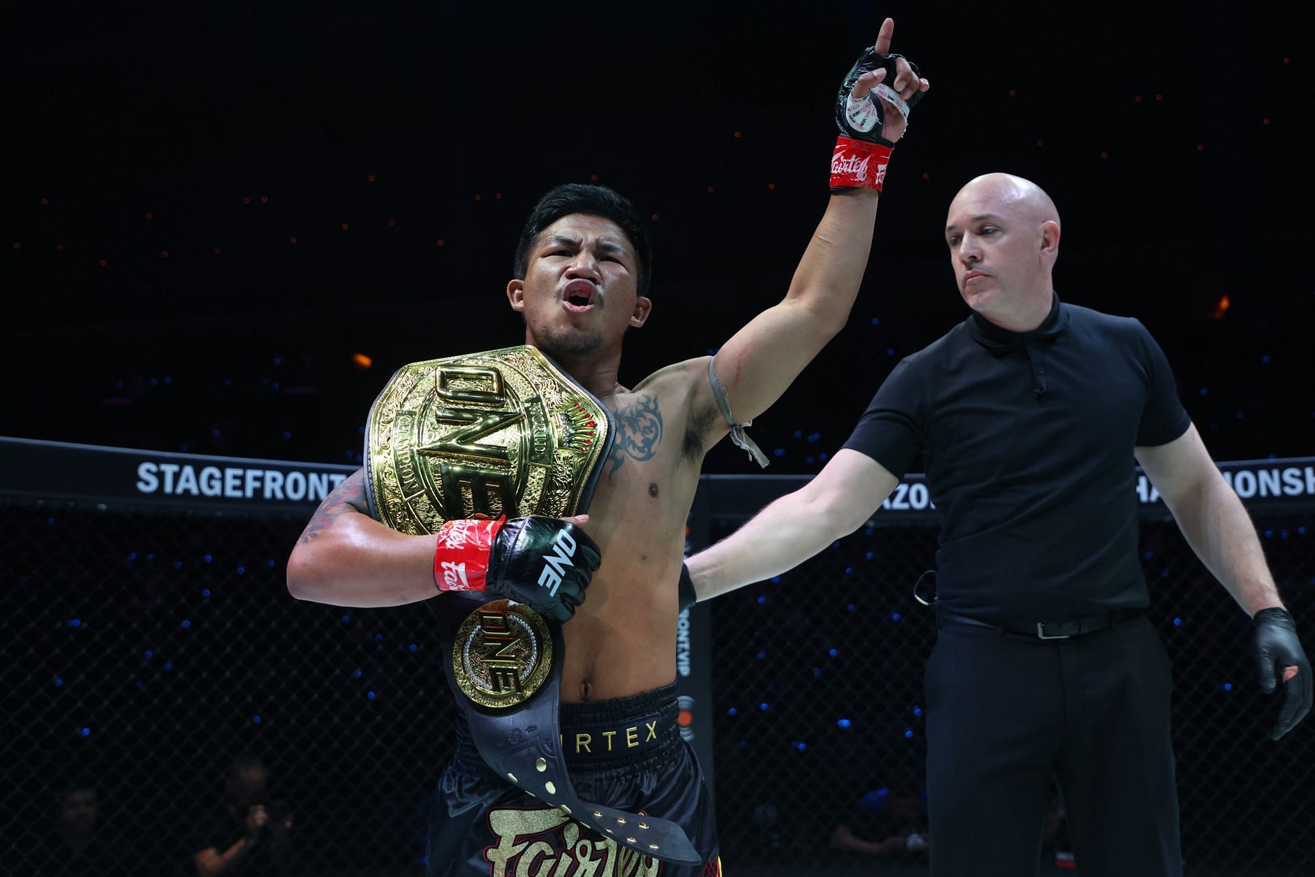 Rodtang Jitmuangnon celebrates his victory over Edgar Tabares in Denver.