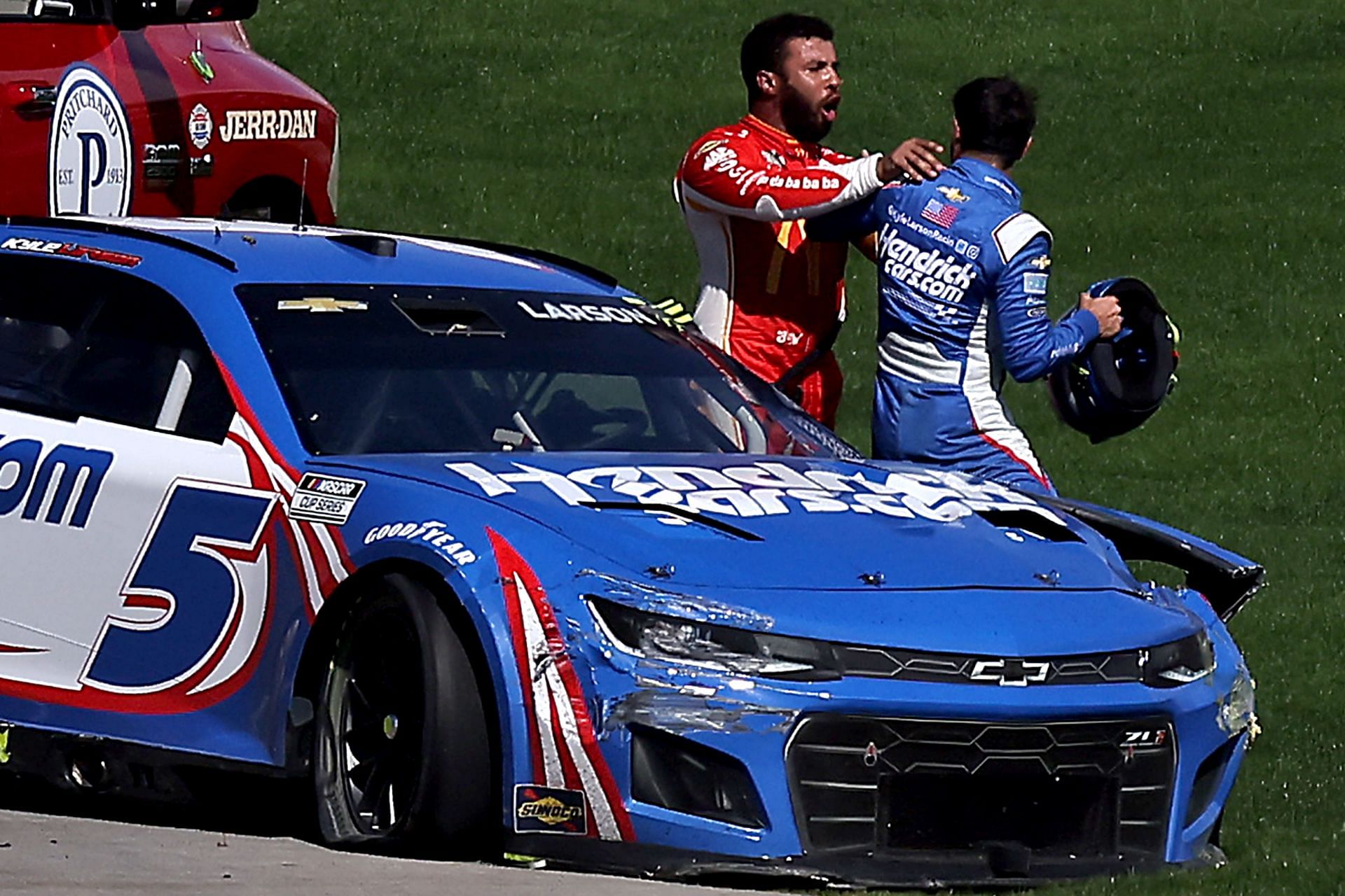 Bubba Wallace, driver of the #45 McDonald&#039;s Toyota, confronts Kyle Larson, driver of the #5 HendrickCars.com Chevrolet, after an on-track incident during the NASCAR Cup Series South Point 400 at Las Vegas Motor Speedway on October 16, 2022 in Las Vegas, Nevada. (Photo by Jonathan Bachman/Getty Images)