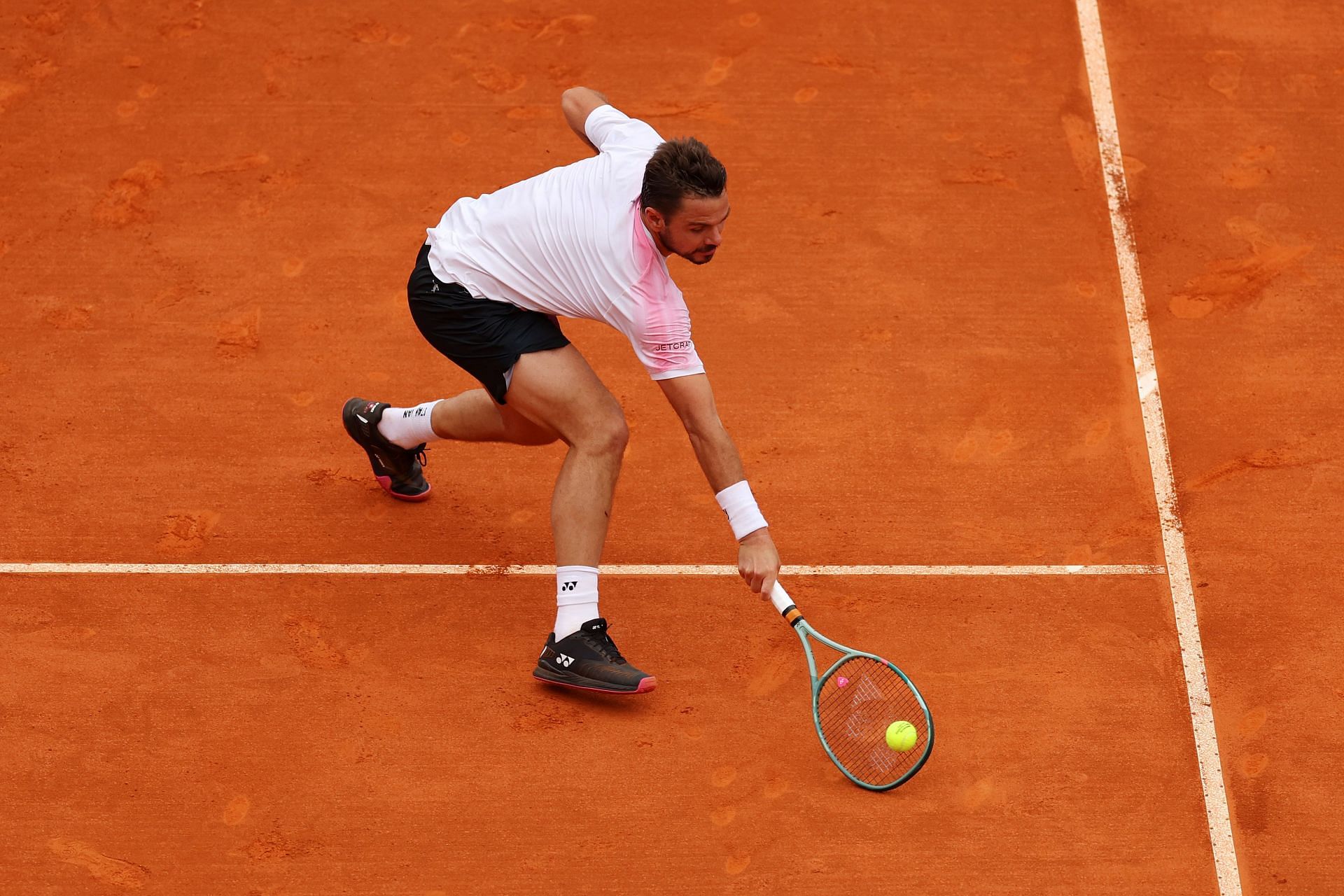 Stan Wawrinka retrieves a ball at the 2024 Monte-Carlo Masters