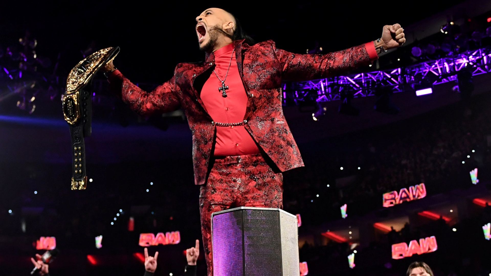 Damian Priest poses with the WWE World Heavyweight Championship on RAW