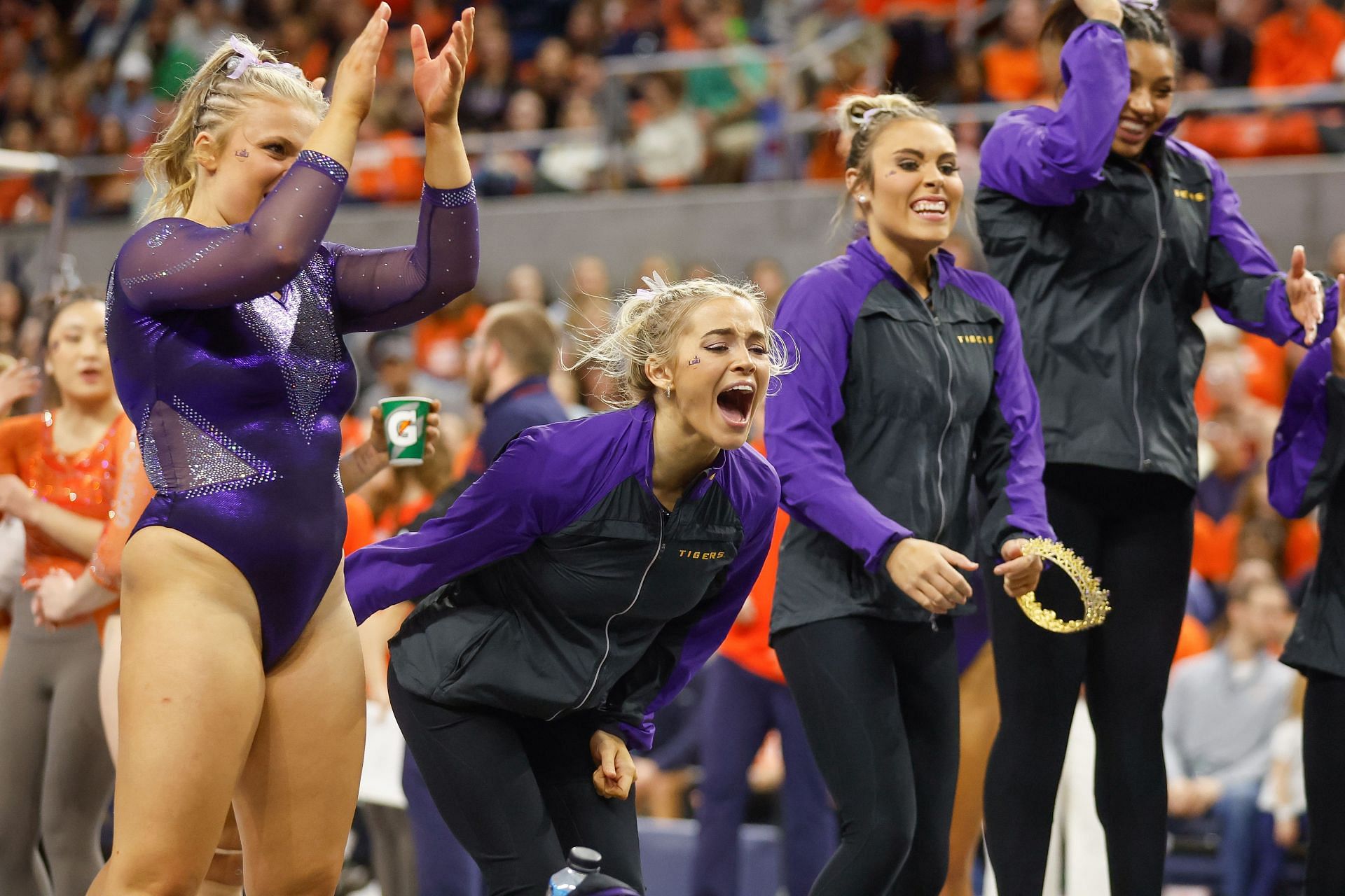 Olivia Dunne of LSU cheers on her teammate during a gymnastics meet against Auburn at Neville Arena on February 10, 2023, in Auburn, Alabama
