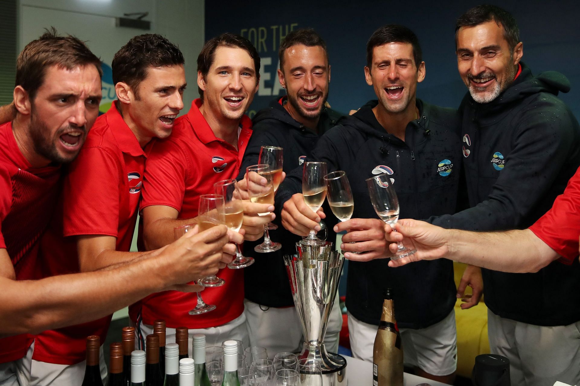 Novak Djokovic and Nenad Zimonjic pose with the 2020 ATP Cup title