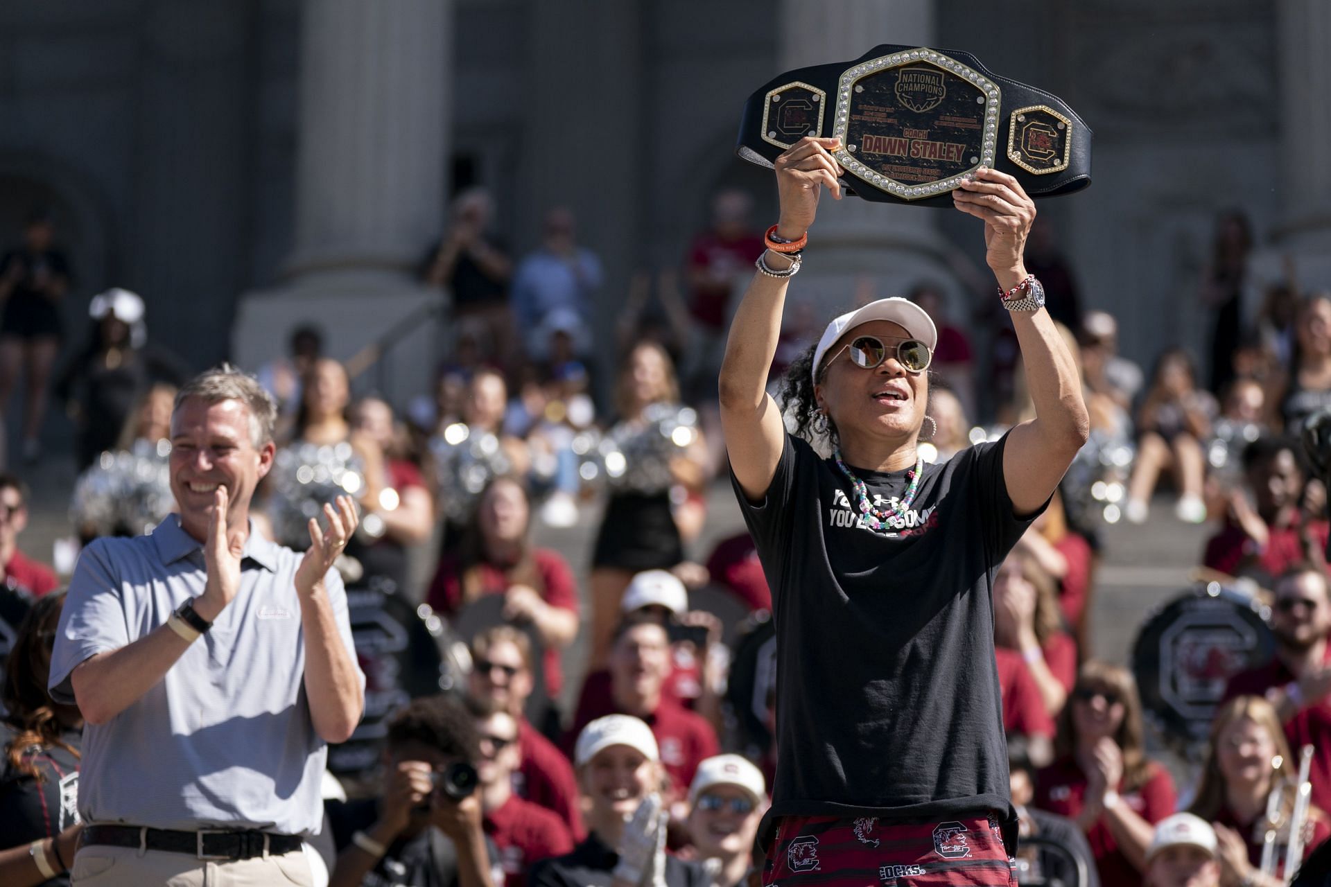South Carolina coach Dawn Staley holds up a championship belt presented by Columbia Mayor Daniel Rickenmann during an NCAA Women&#039;s Basketball Championship celebration.