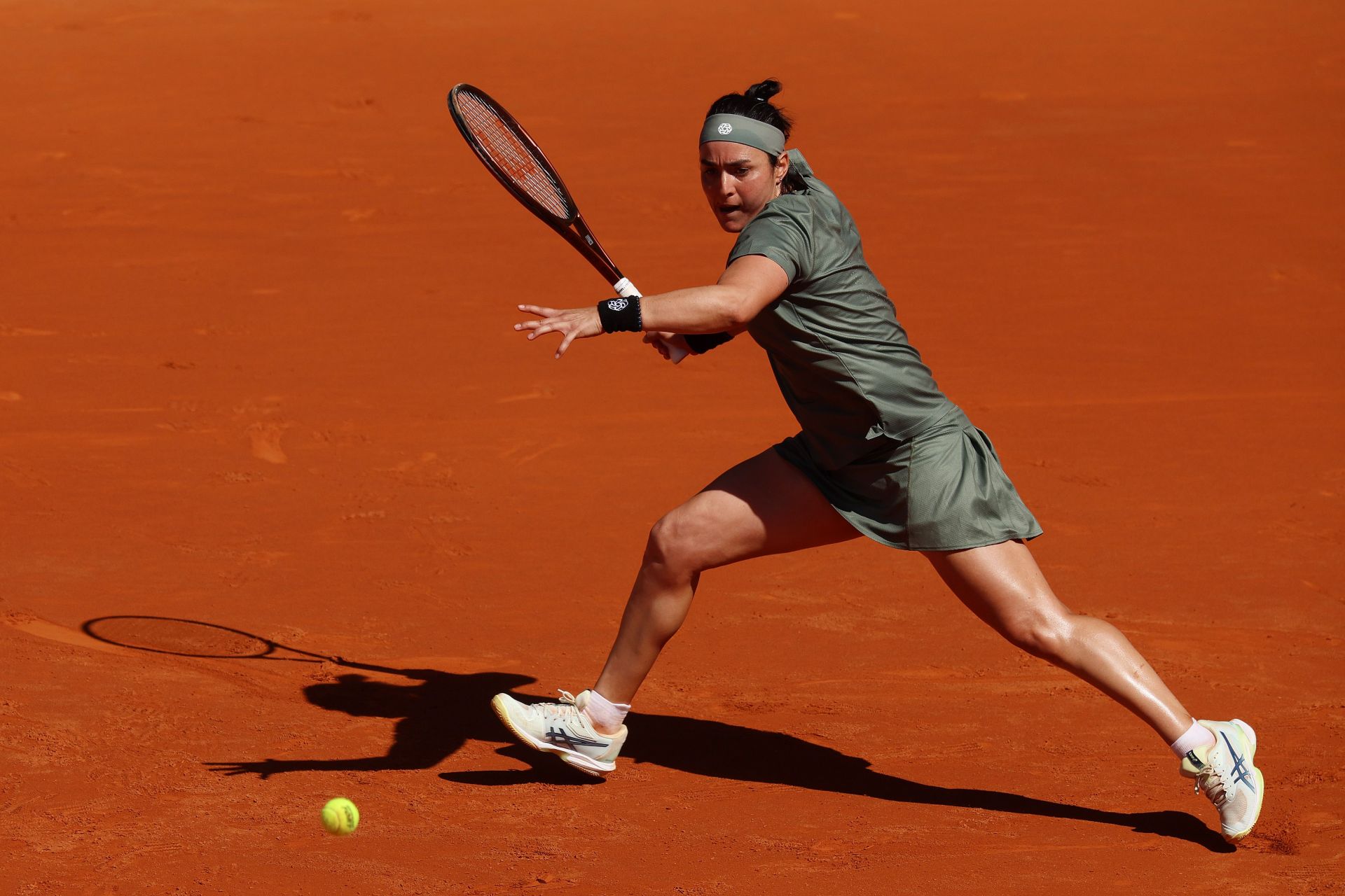 Ons Jabeur in action against Jelena Ostapenko at the 2024 Madrid Open